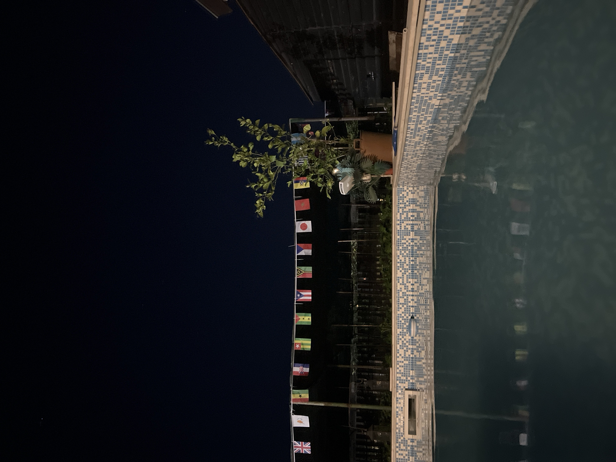 Evening poolside relaxation with outdoor movie in Debelt, Bulgaria