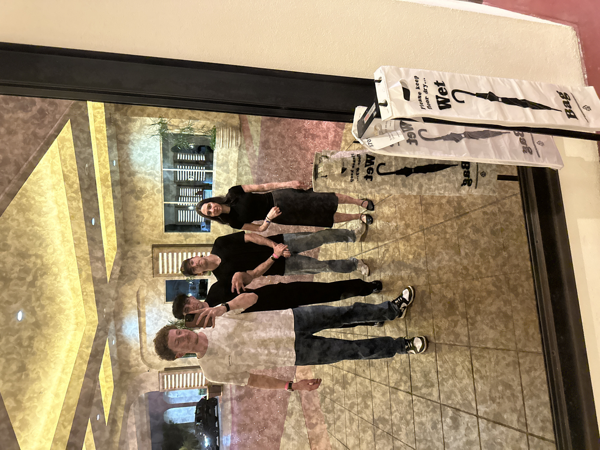 Group of four photographed near mirrored wall at Seminole Reservation