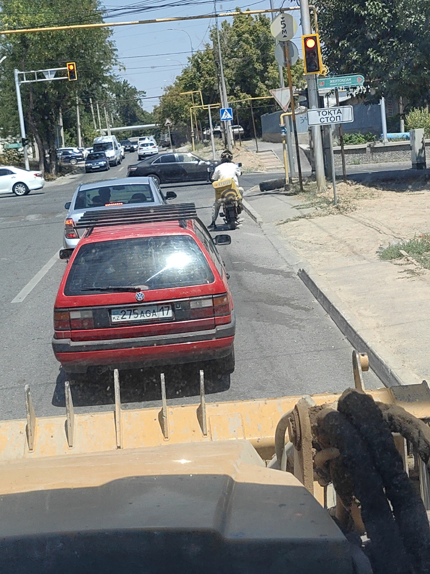 Morning traffic in Shymkent, seen from two vehicles