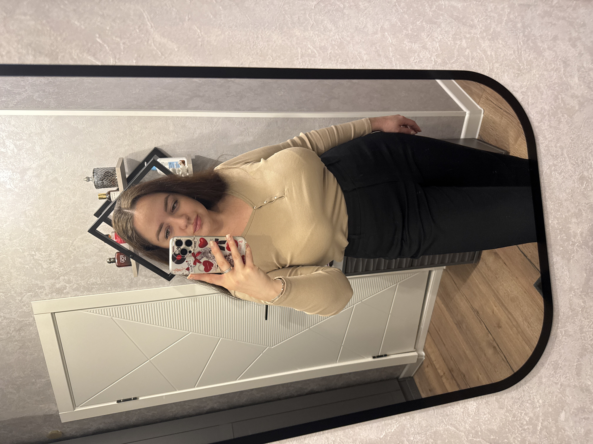 Woman takes mirror selfie in Yakhroma, Russia