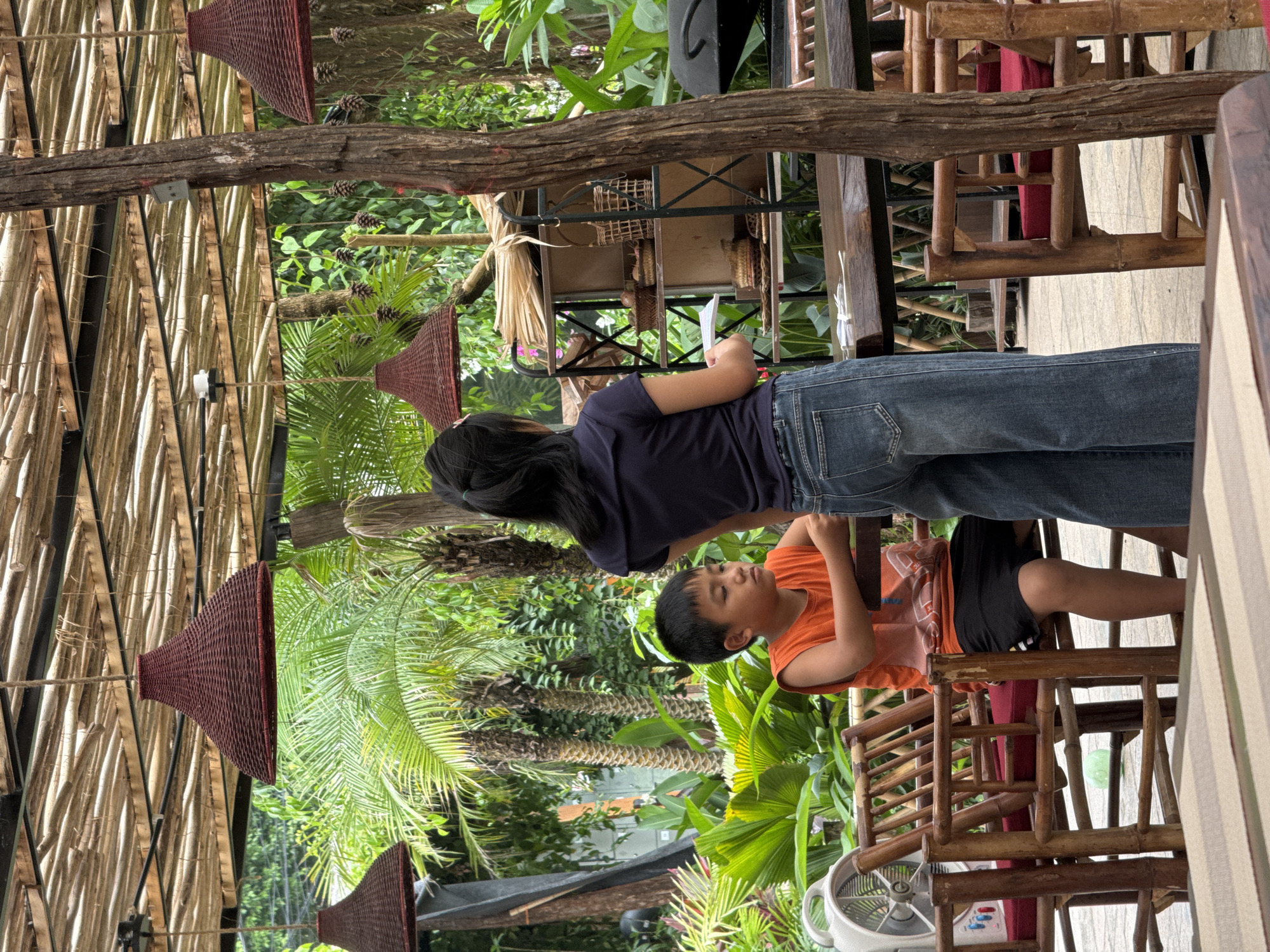 Late-night family dining captured at Vietnamese tropical restaurant
