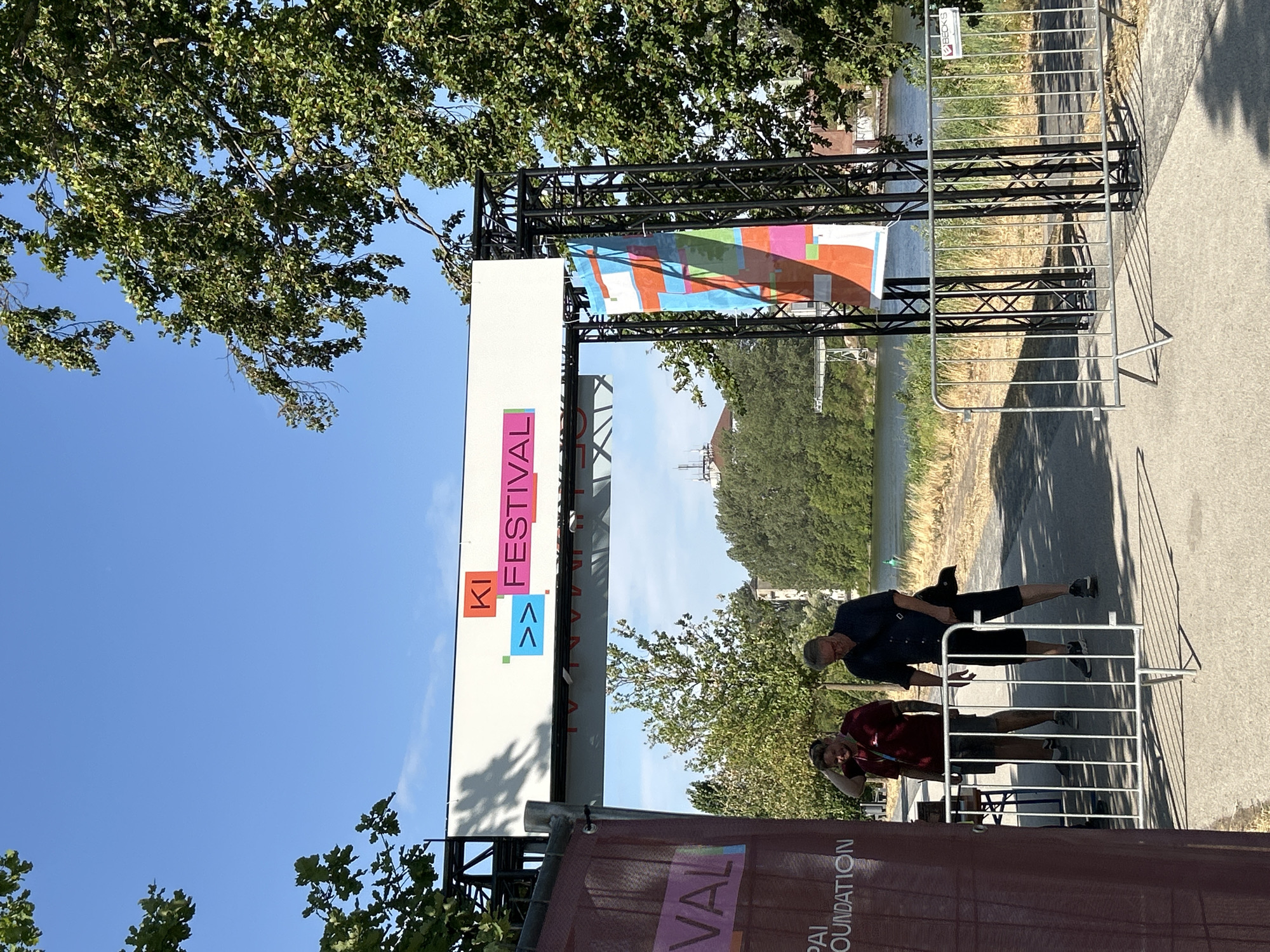 KI Festival grounds on a sunny day, tents and vintage photo van