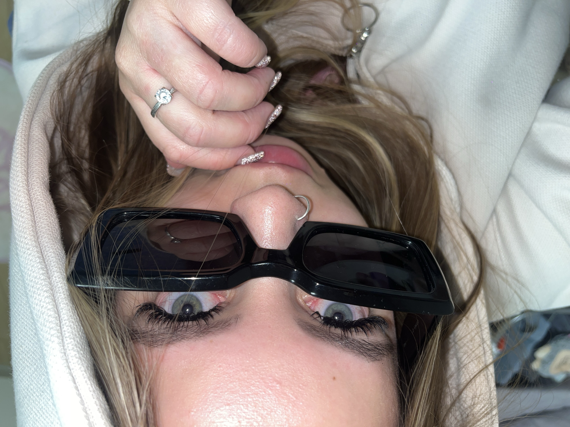 Person photographed lying down wearing sunglasses in Krasnodar
