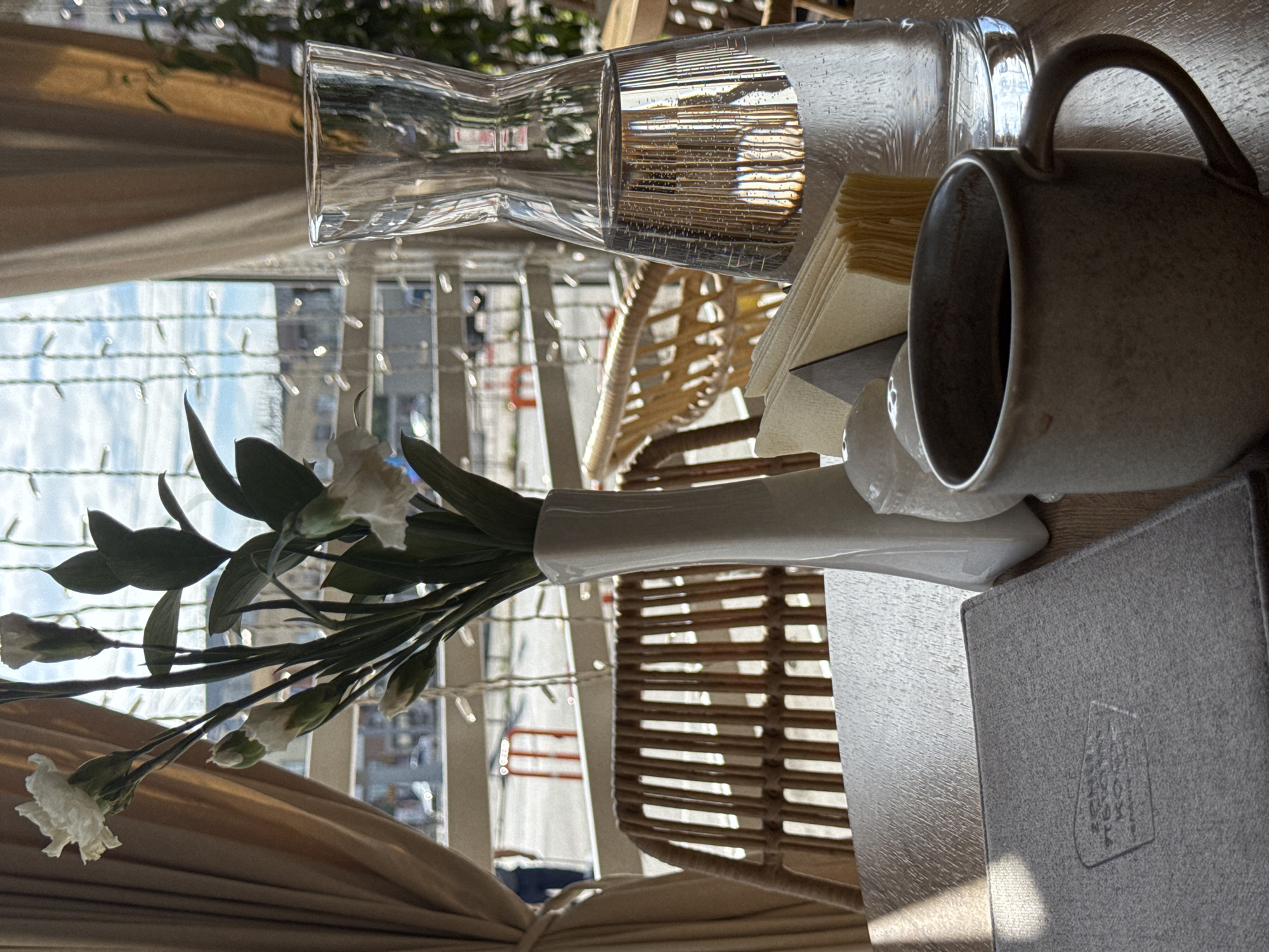 Café table setting with coffee and menu in Omsk