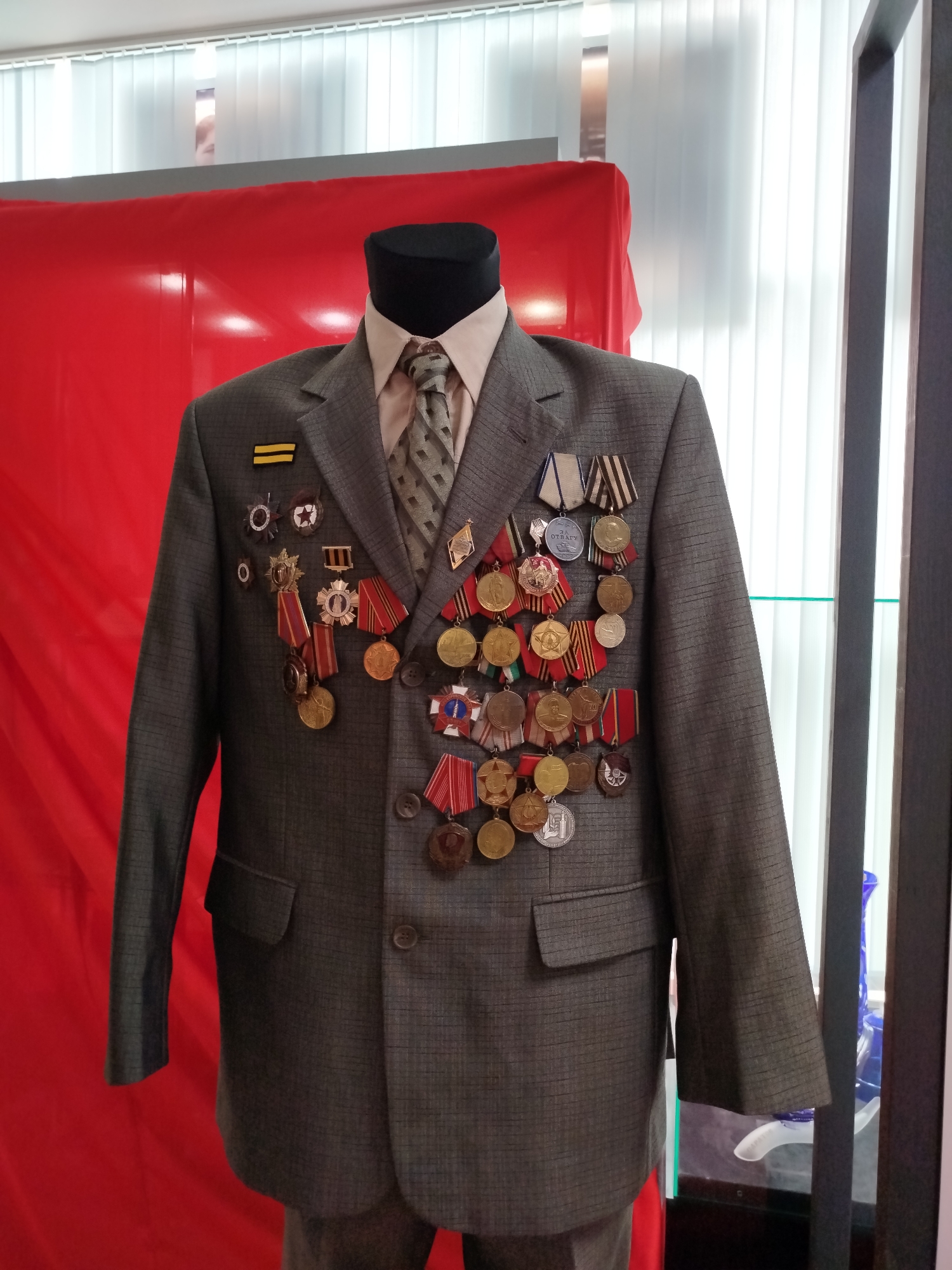 Military hardware, historical dress, and vintage tech at a museum