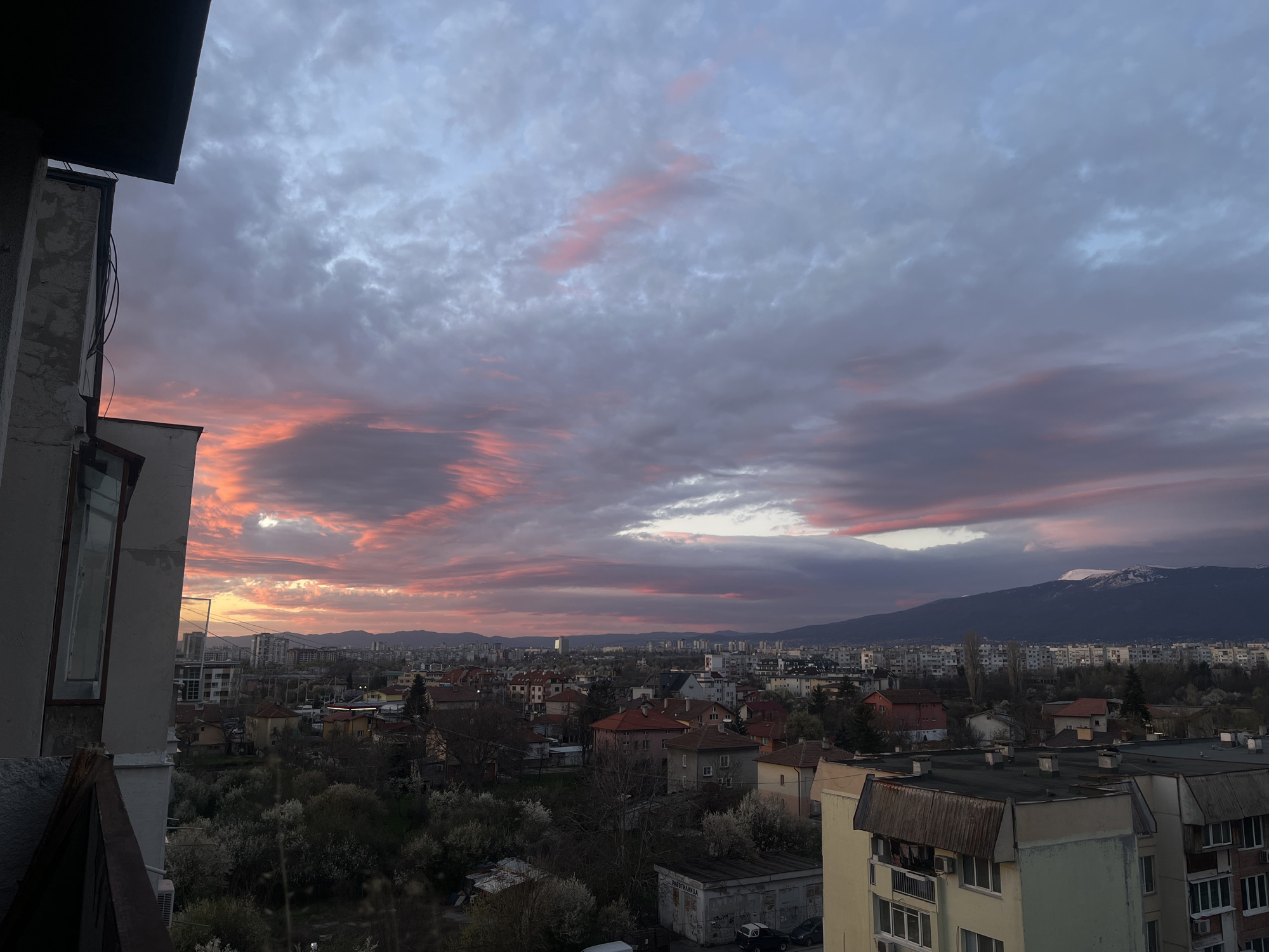 Dramatic sunset illuminates Sofia skyline, witnessed citywide