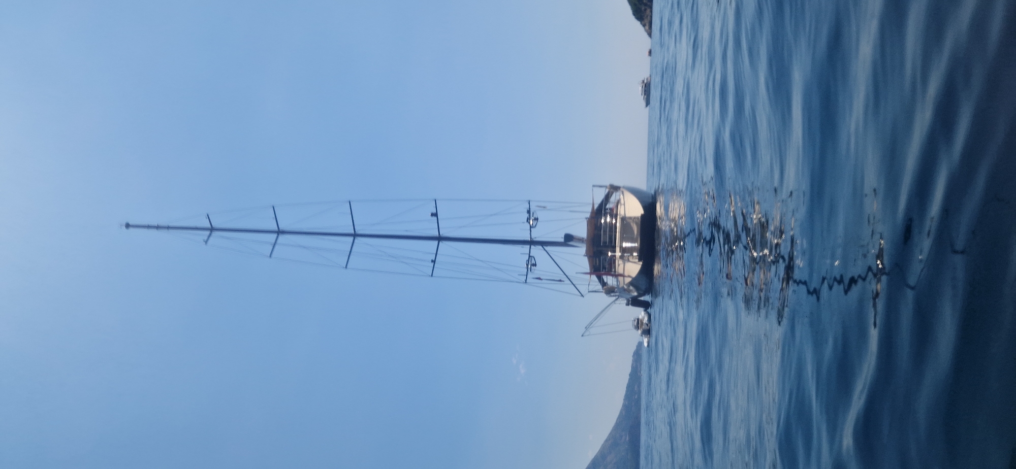 Sailboats and motorboats out on a calm Boreti bay