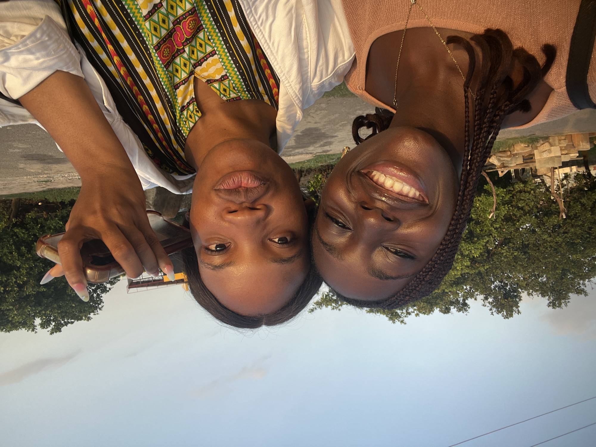 Friends capture selfies during golden hour in Karum, Nigeria