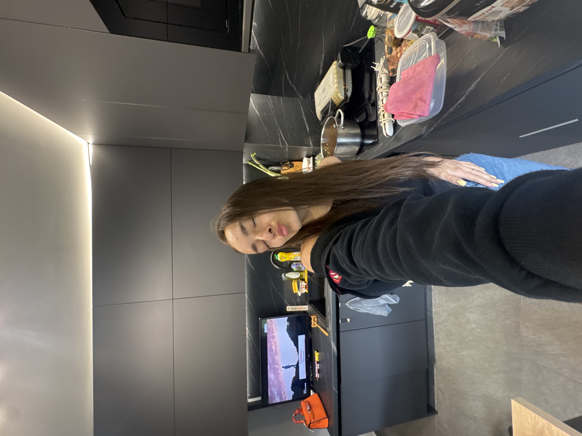 Woman takes selfie in Sofia kitchen