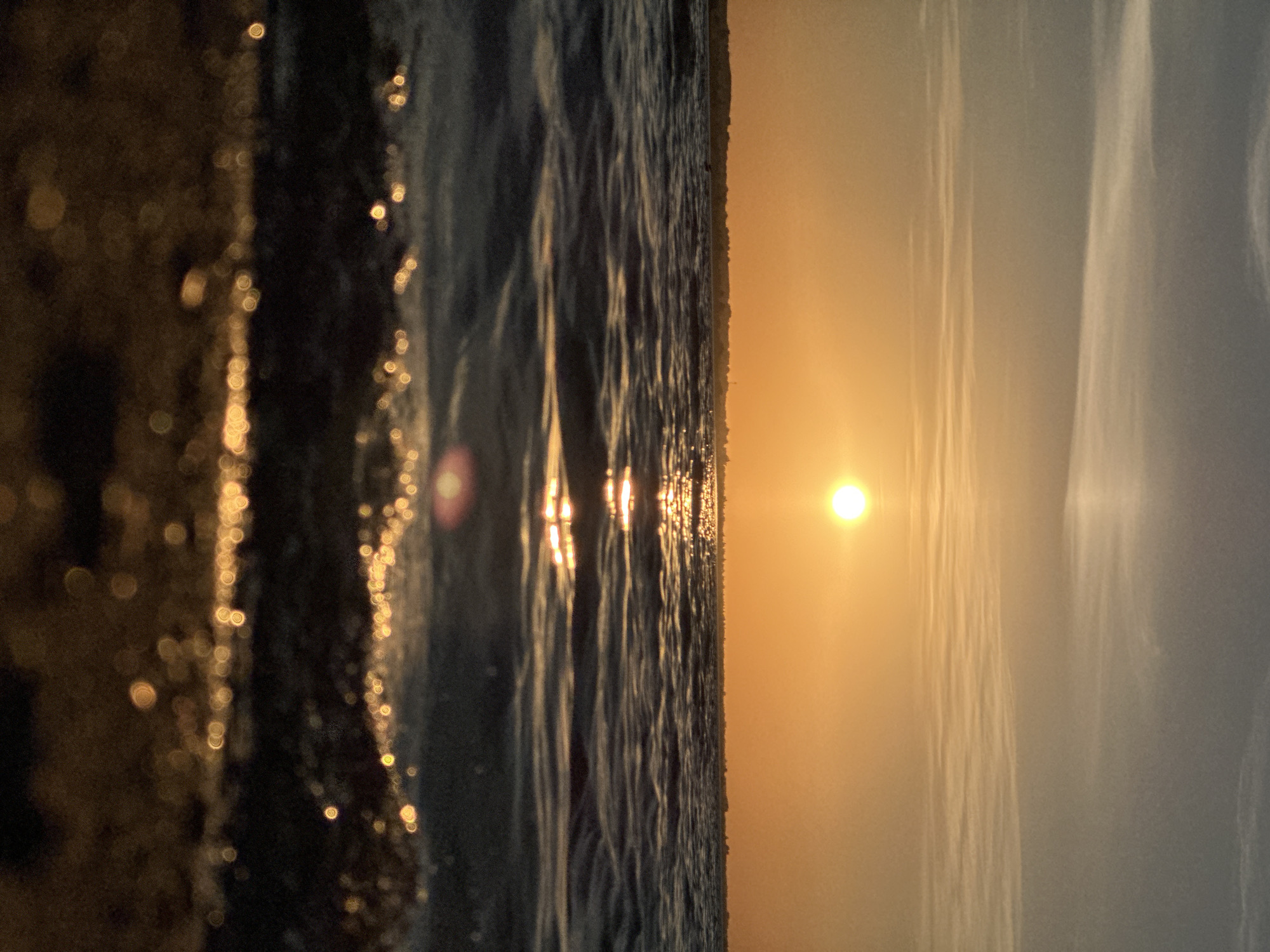 Warm sunset reflects across a lake near Kokshetau