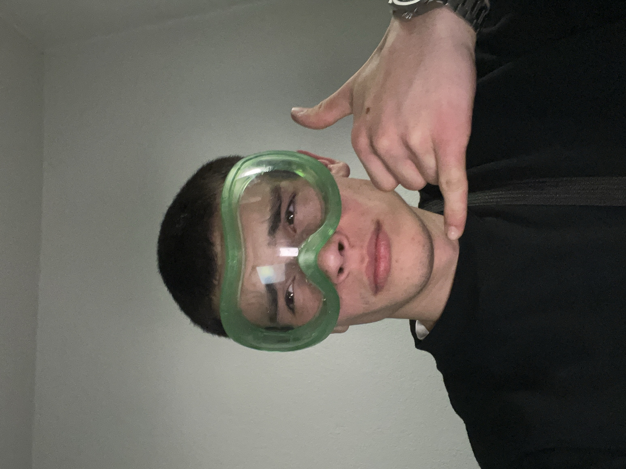 Person in green goggles takes selfies in Karavelovo