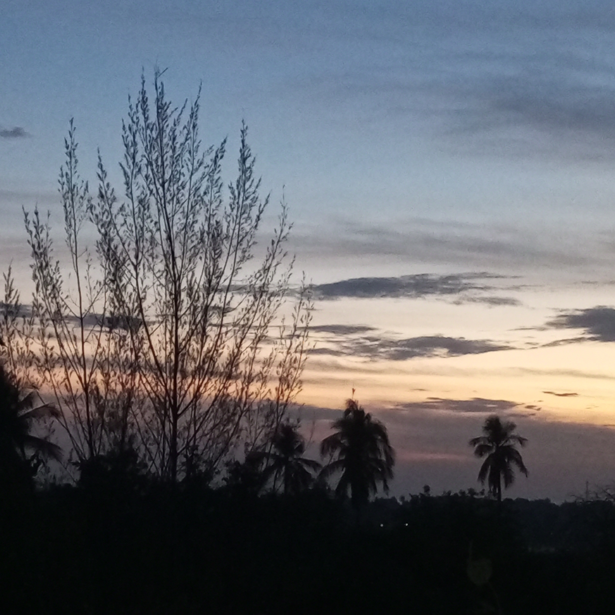 Twilight sky documented across Lhokseumawe, Indonesia cityscape