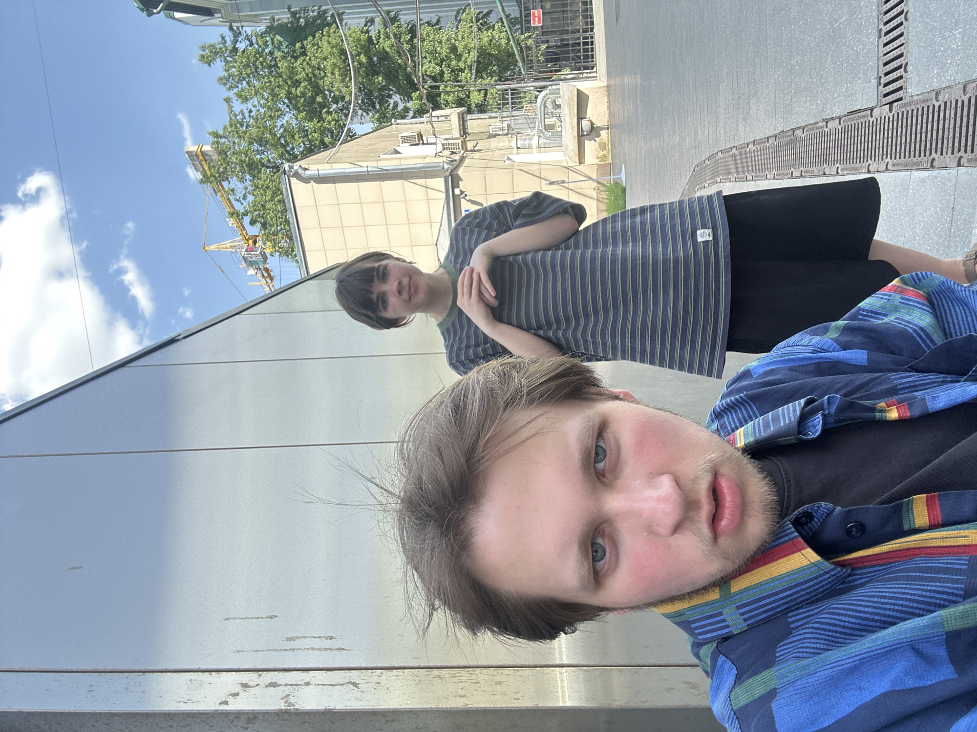 Street fencing match observed between two youth in urban setting