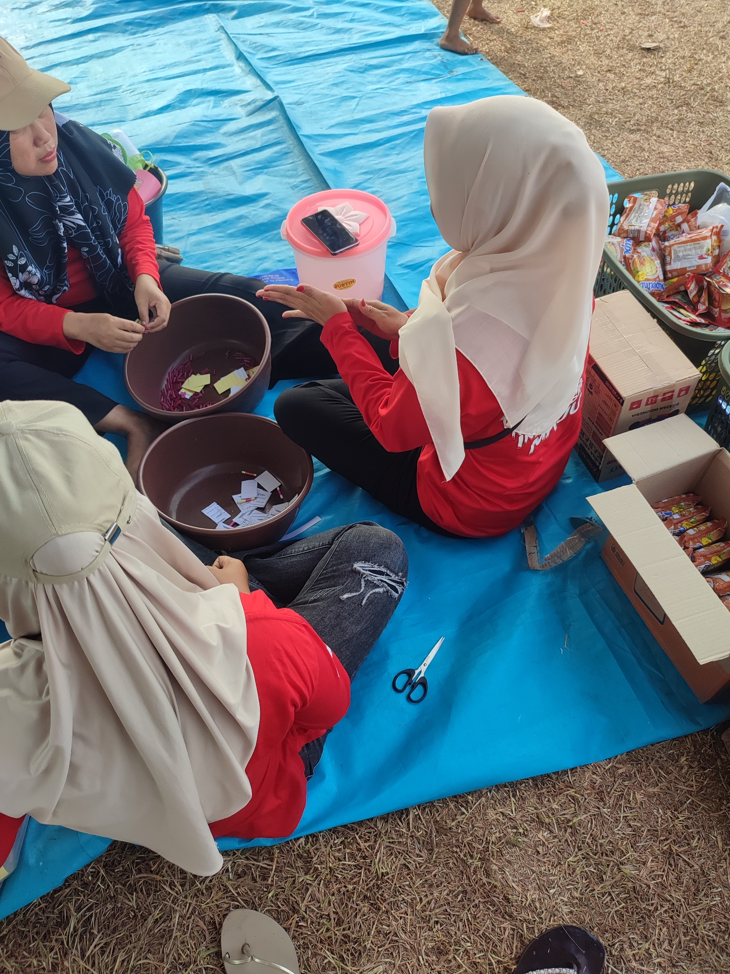 Casual outdoor community gathering with food stall, Nusa Jaya