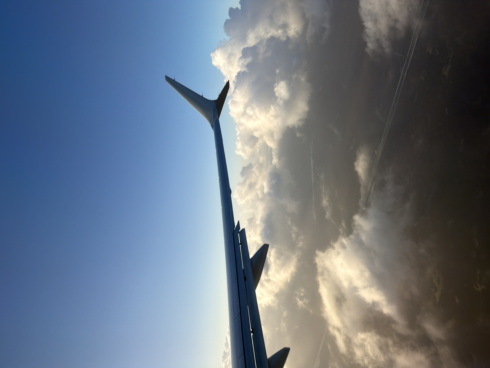 Aircraft wings photographed in flight over Miami area