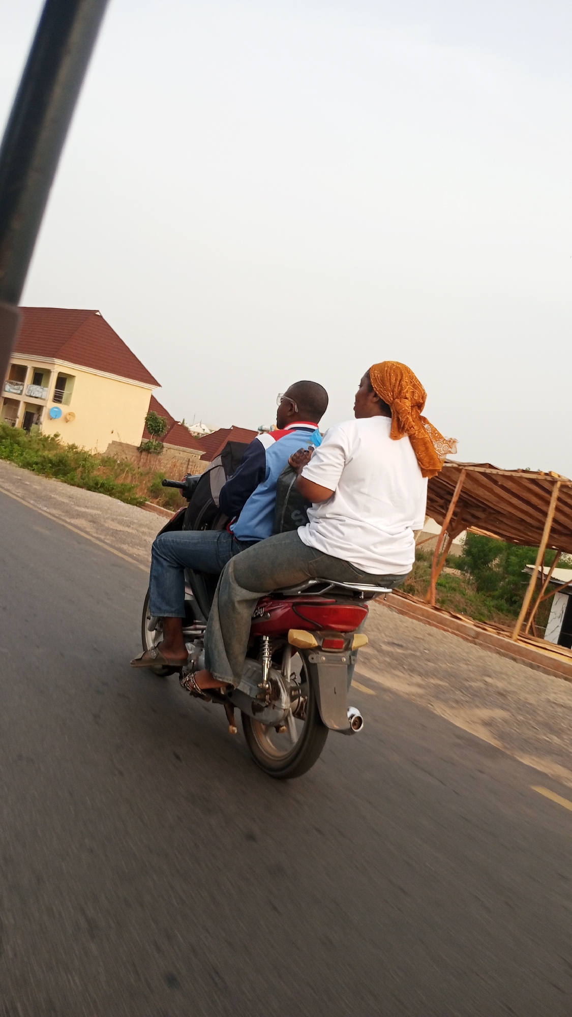 Two people spotted riding red motorbike in Zango-ndaji