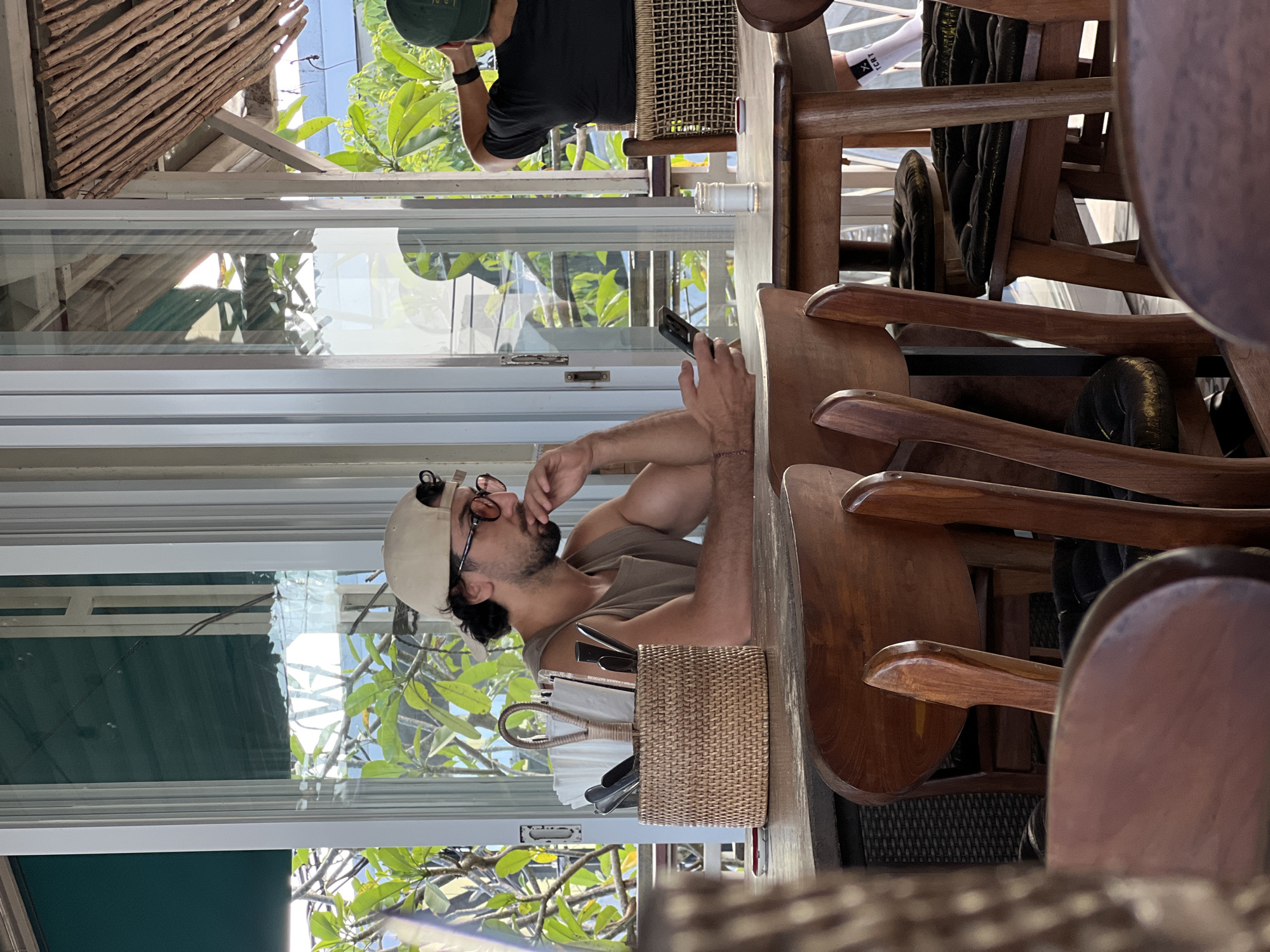Morning moments captured in North Kuta: phone user, bonsai collection