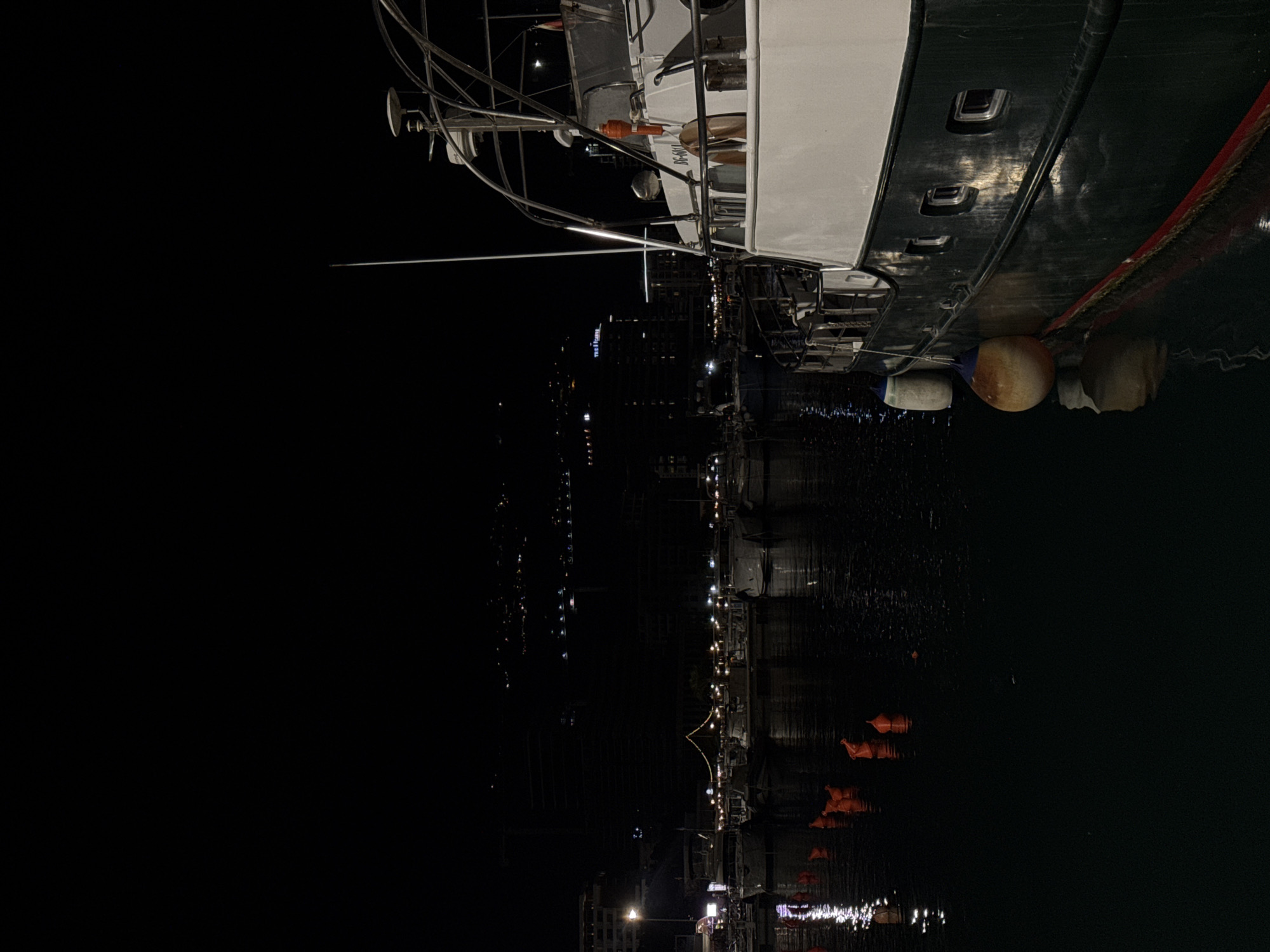 Docked boat with distinctive markings observed at urban waterfront