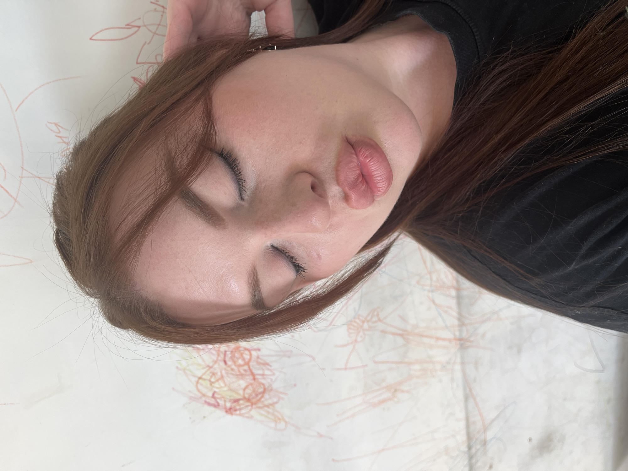 Woman photographs herself in morning selfie session in Pavlovka