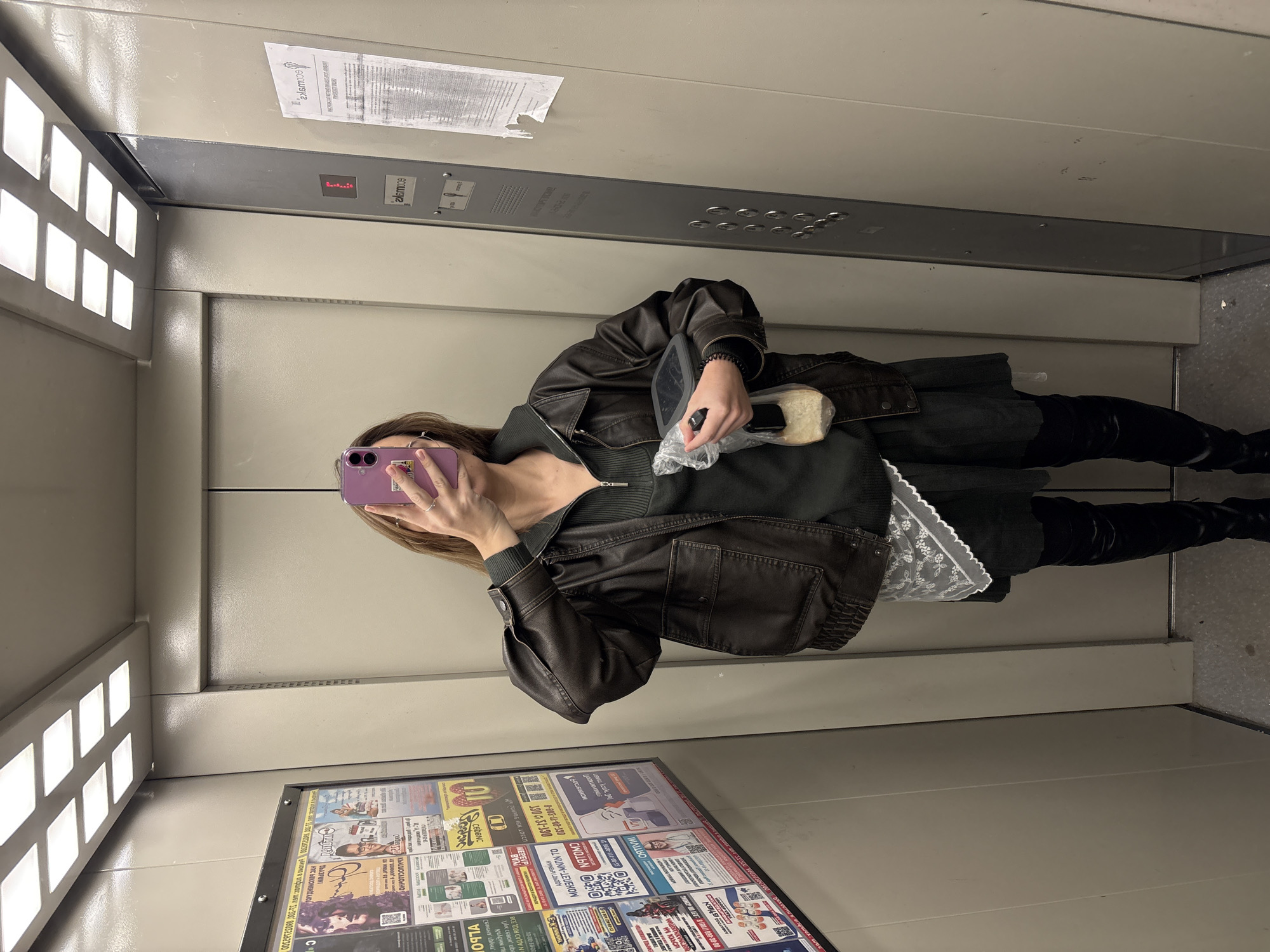 Woman takes elevator selfies in Ust-Ilimsk, Russia