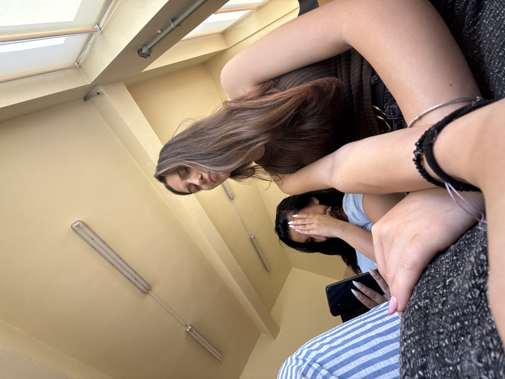 Quiet moment in a Sofia classroom, phone in hand