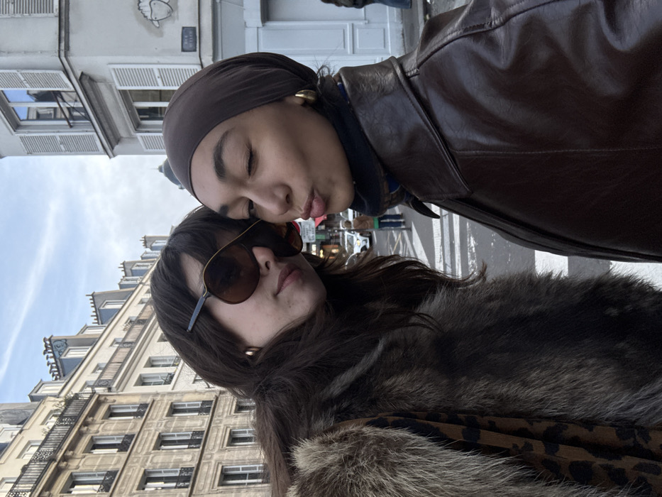 Two women document casual afternoon together in Paris streets
