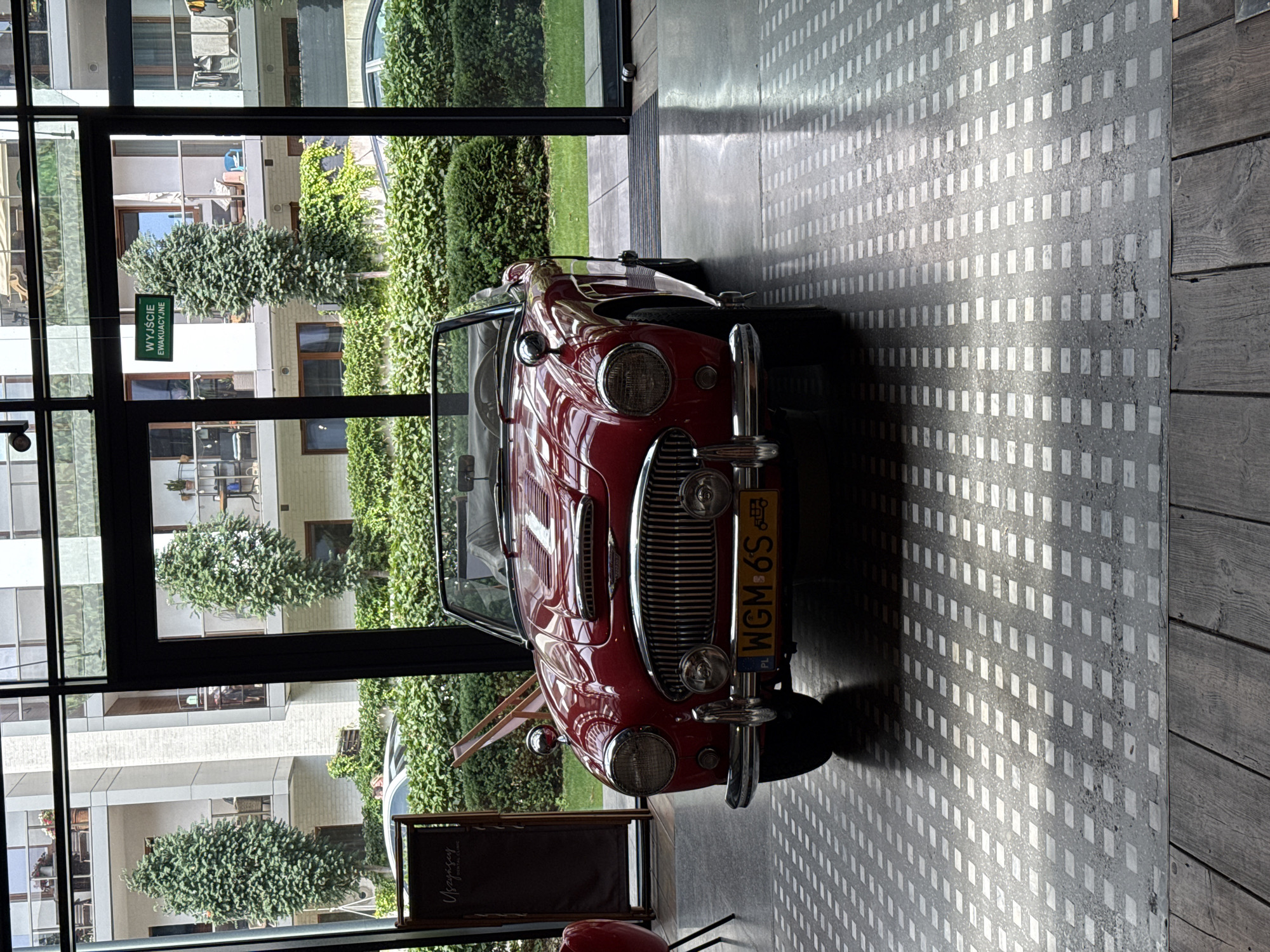Vintage convertible and piano in a Warsaw indoor venue