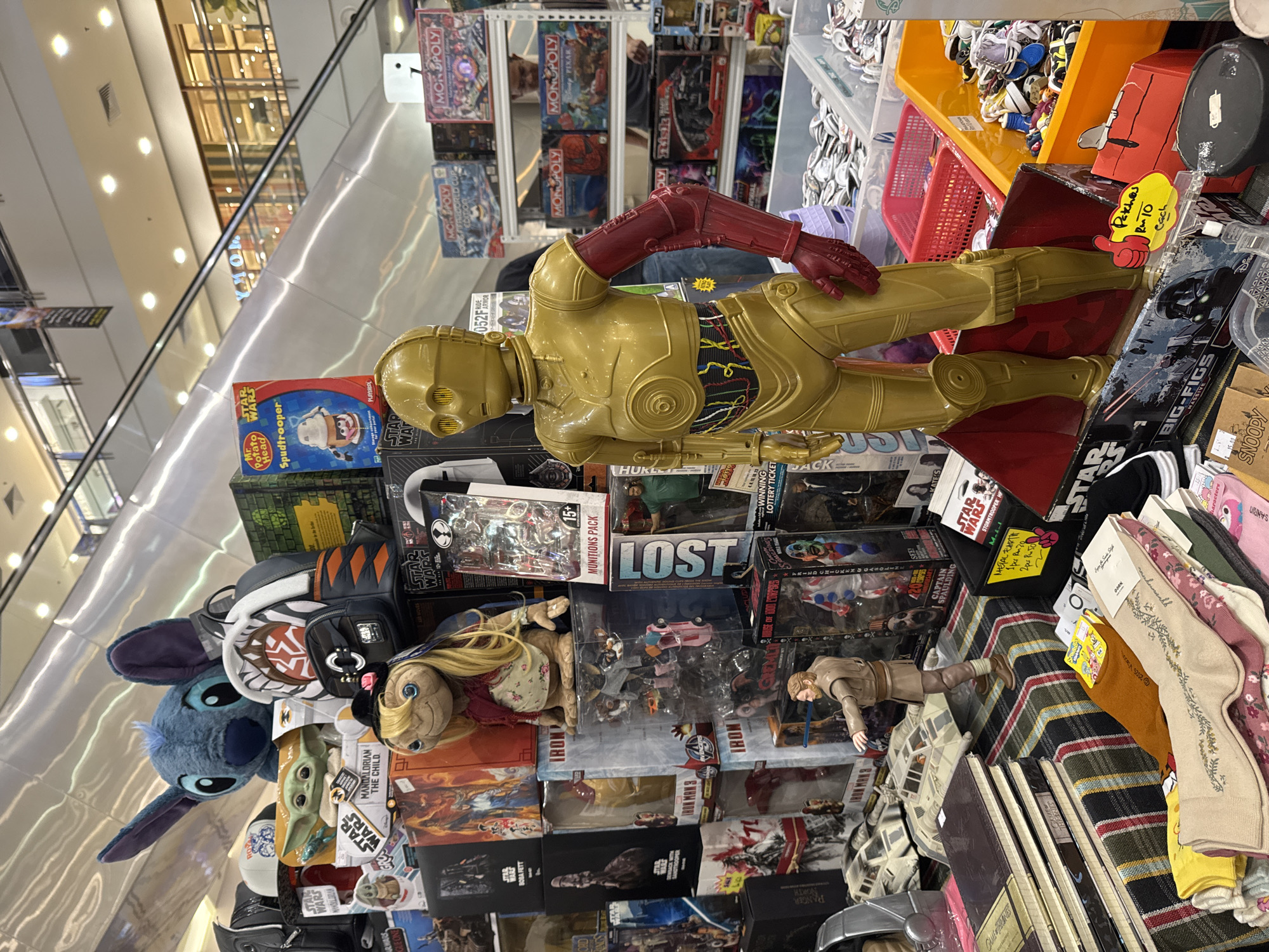 Pop culture collectibles and home decor stalls fill a KL indoor market