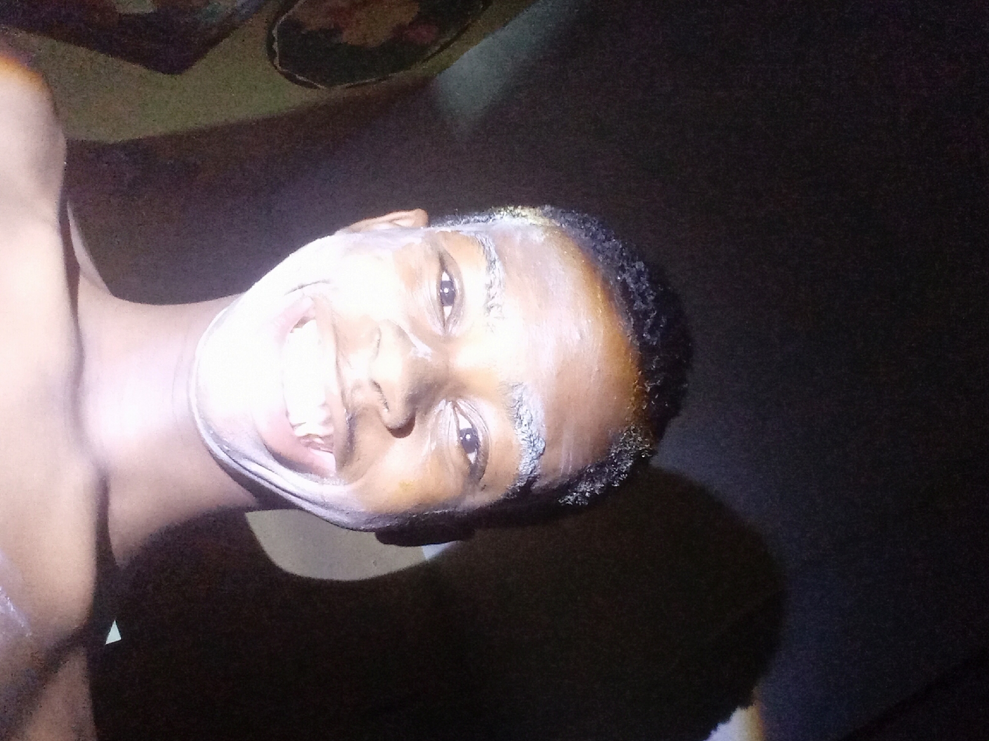 Person documents grooming routine in Nkpor, Nigeria residence