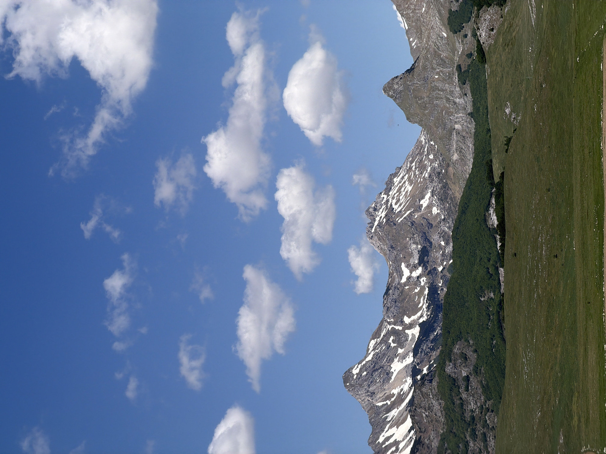 Mountain landscape with snow patches observed in Pašina voda, Montenegro