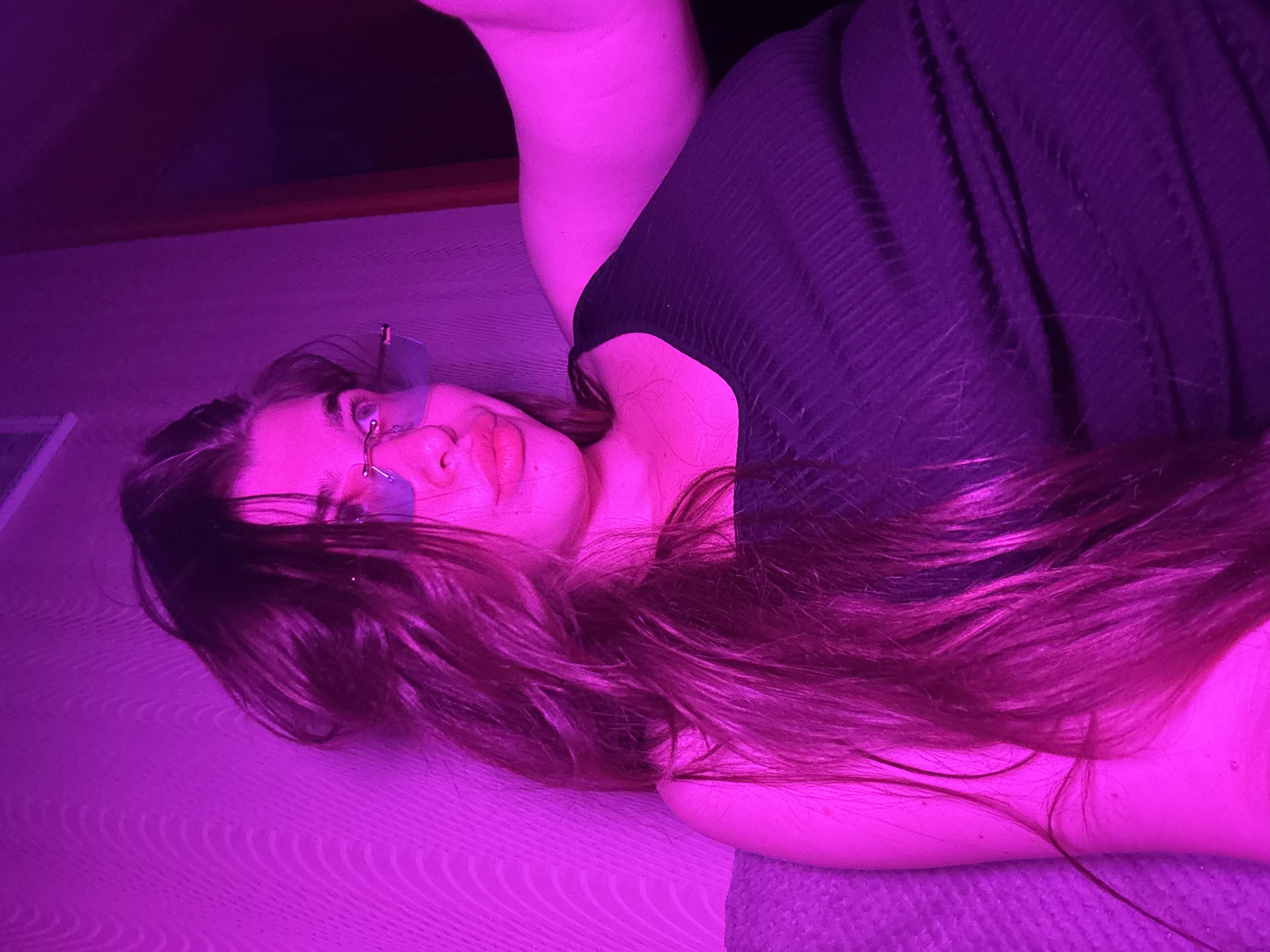 Evening selfie session with colorful lighting in Russian bedroom