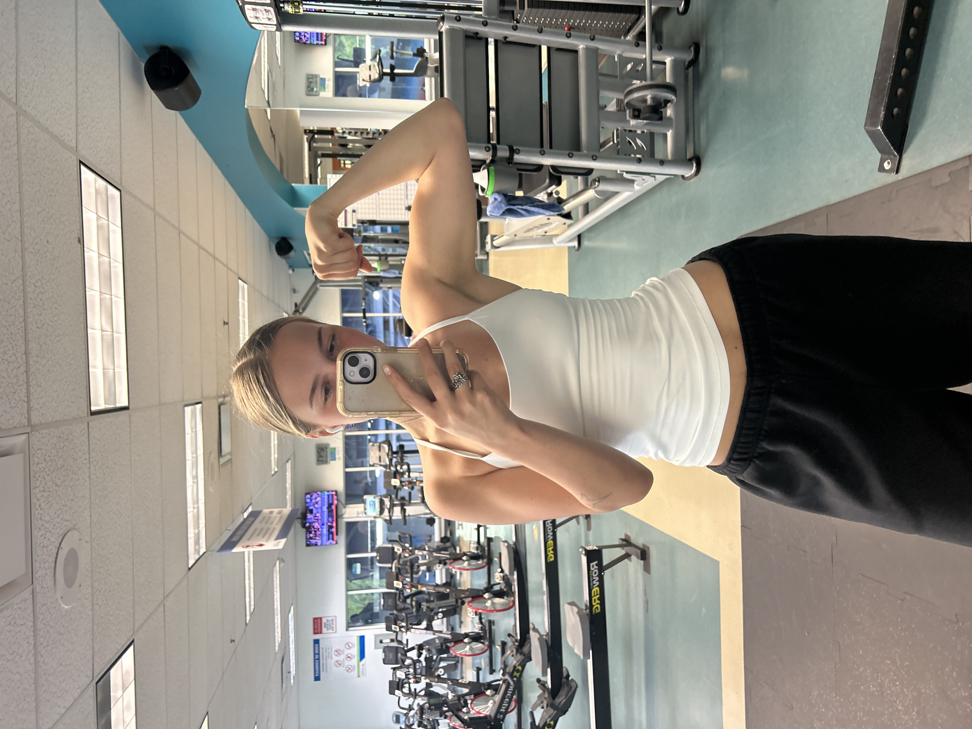Woman takes gym selfies in Whistler fitness center