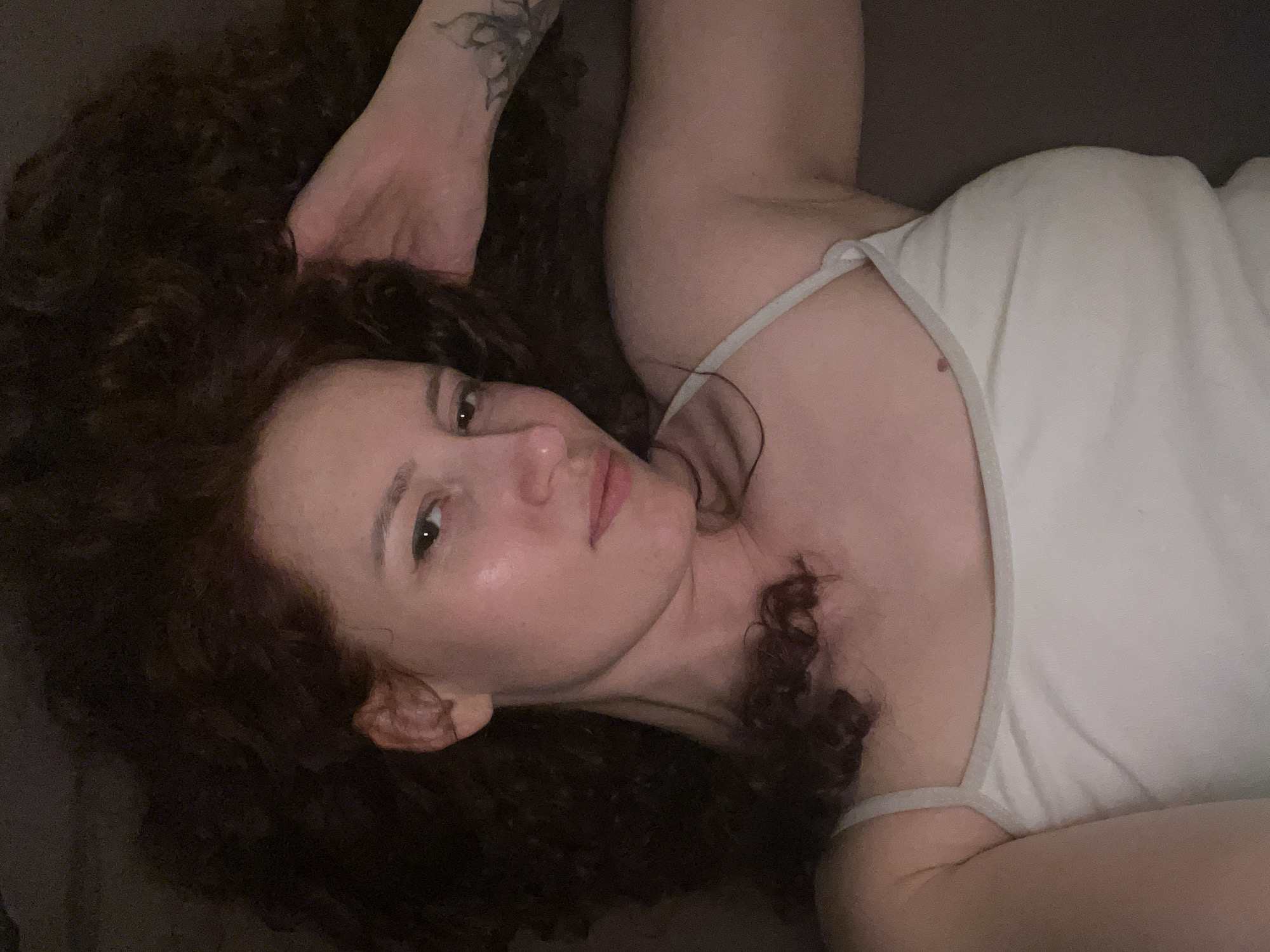 Woman resting on gray surface observed in Saint Petersburg