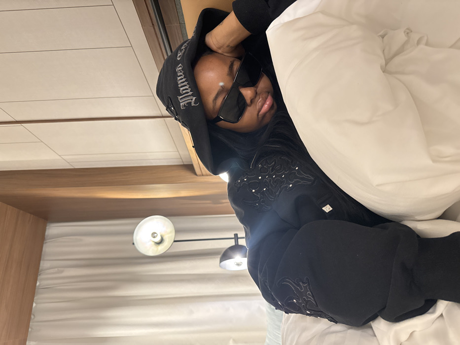 Woman rests in Milan hotel room