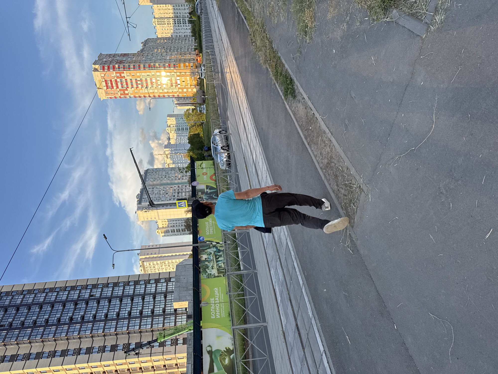 Man walks past construction site in Chaltyr', Russia