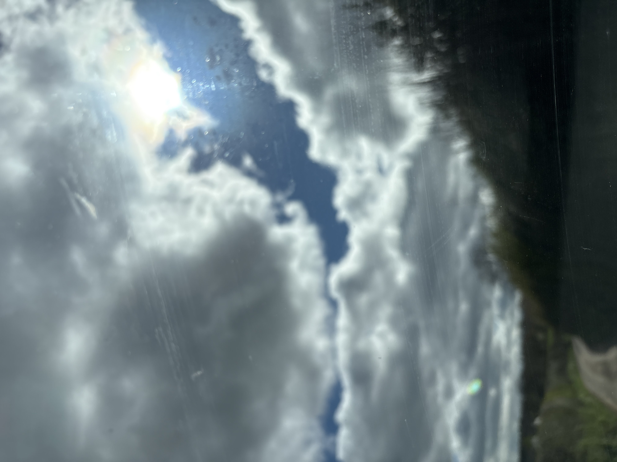 Cloudy skies photographed from vehicles in Pulverbatch countryside