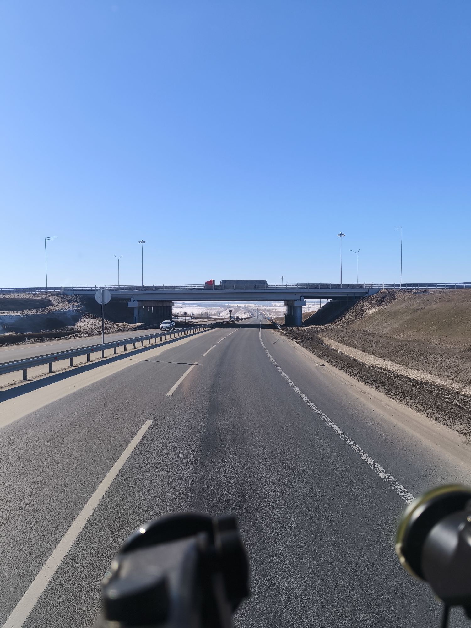 Morning traffic flows on highway near Shali, Russia