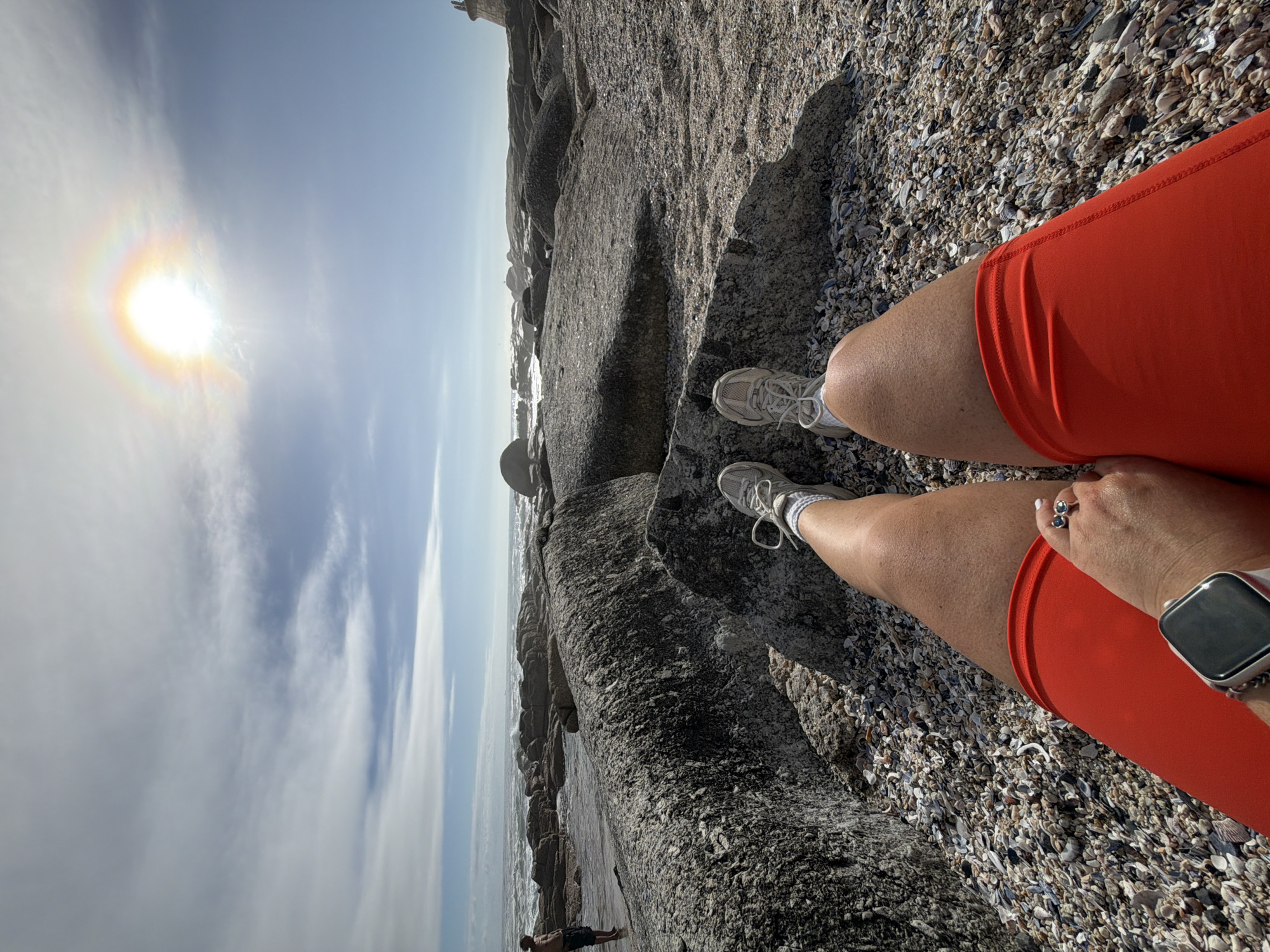 Person spotted on shell-strewn Cape Town beach