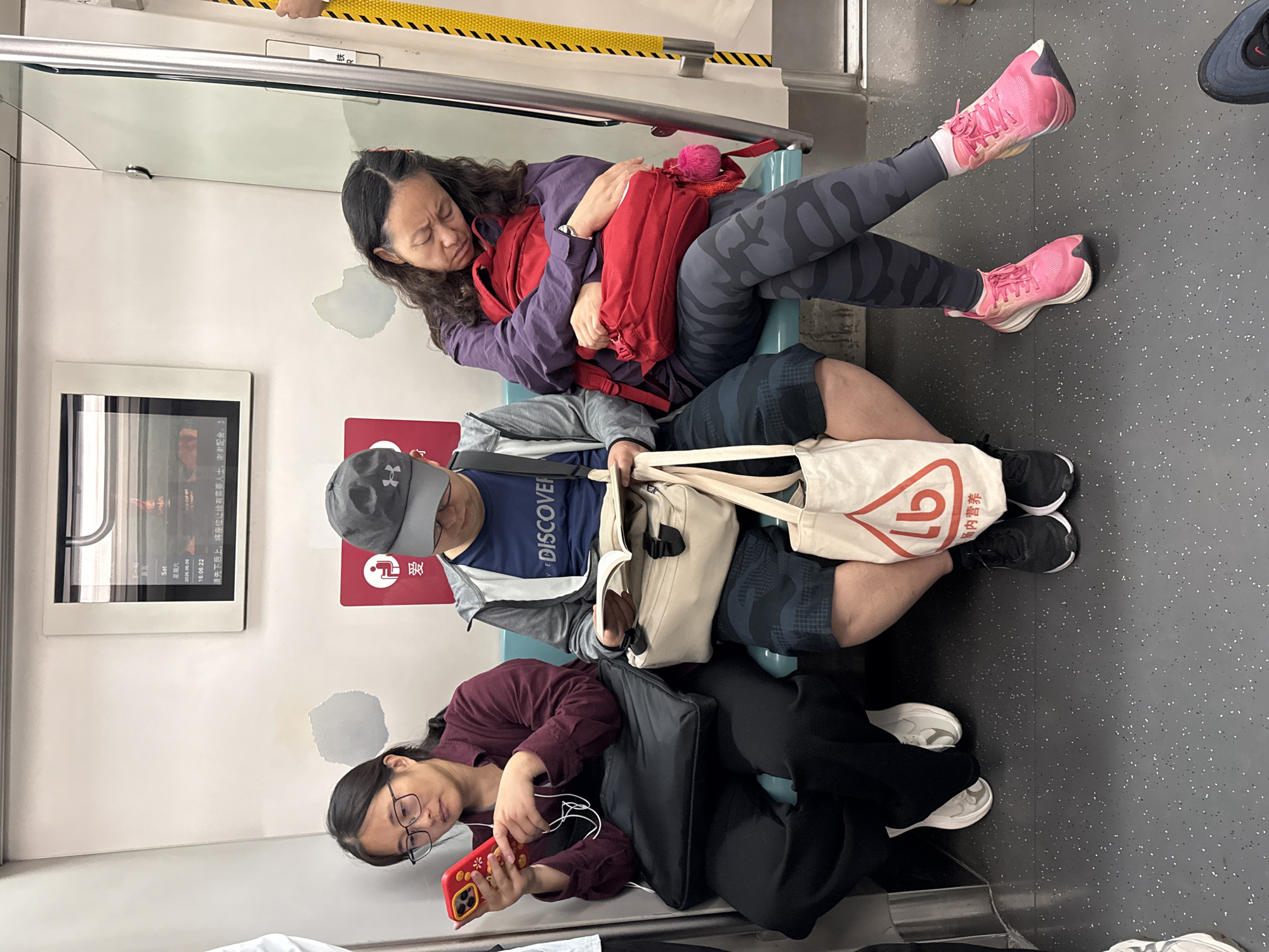 Morning commuters ride subway at Beijing's Xingong station