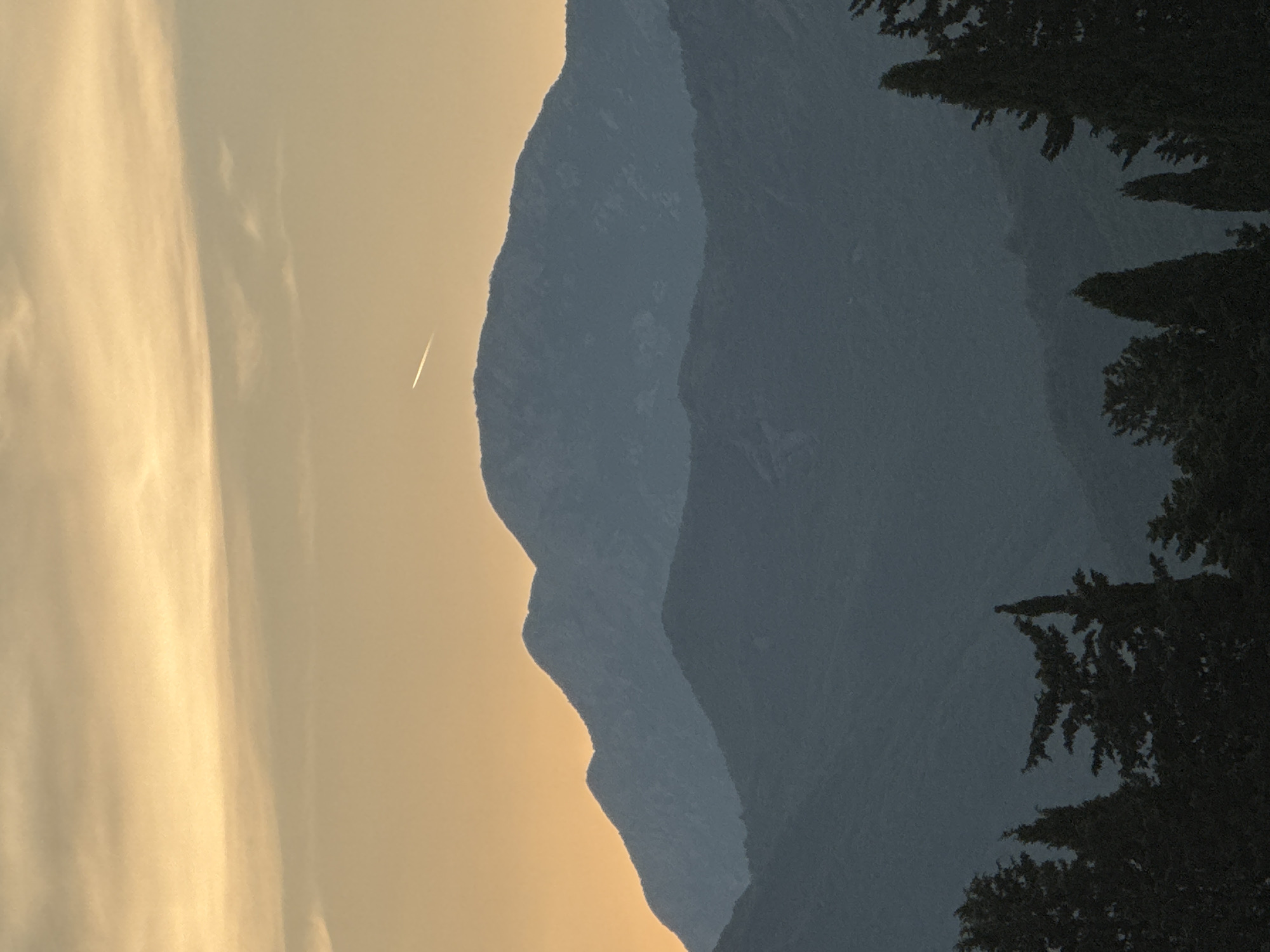 Waterfront sunsets, mountain views, and a cruising ship at dusk