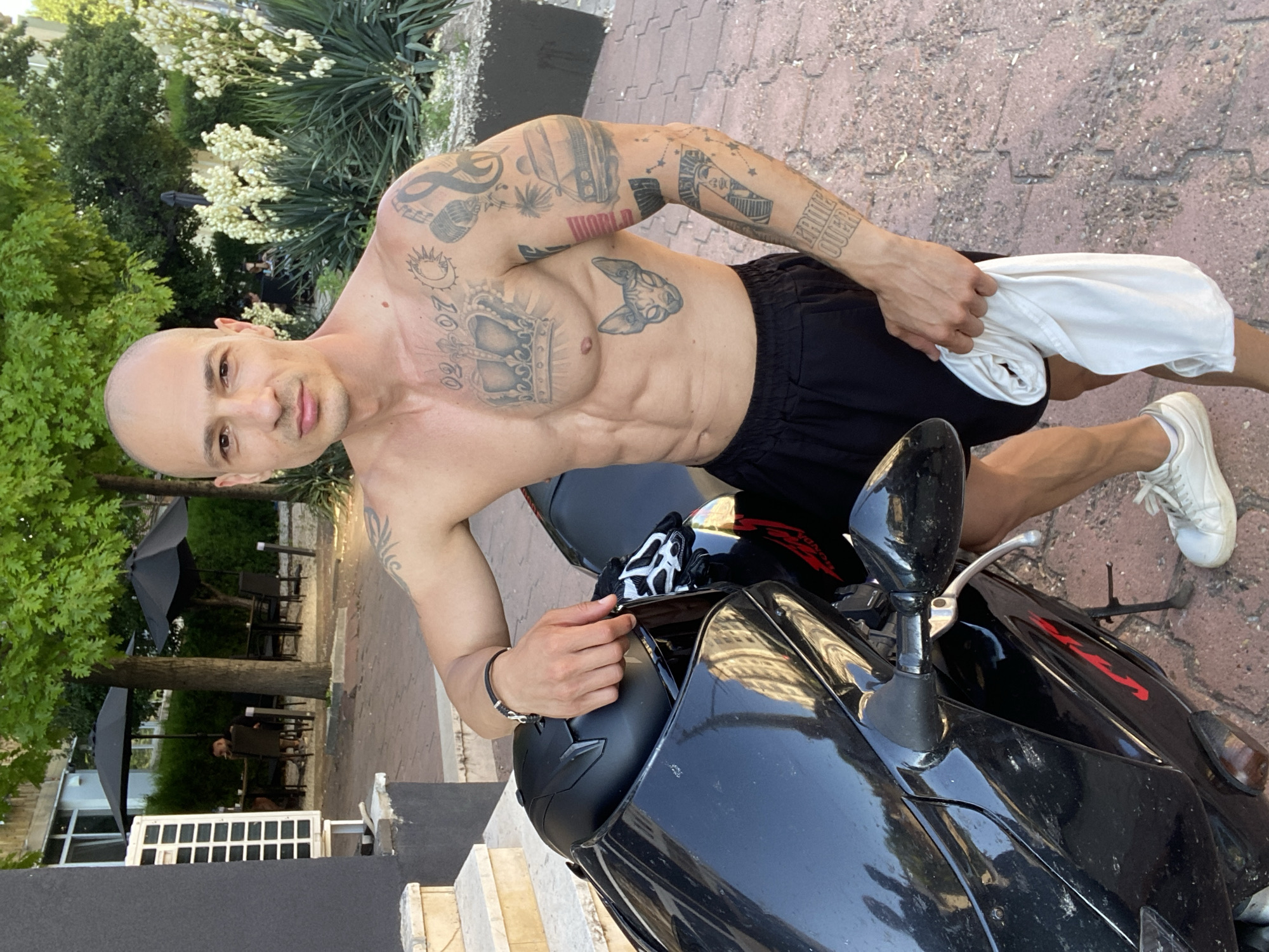 Man poses with motorcycle in Pleven, Bulgaria