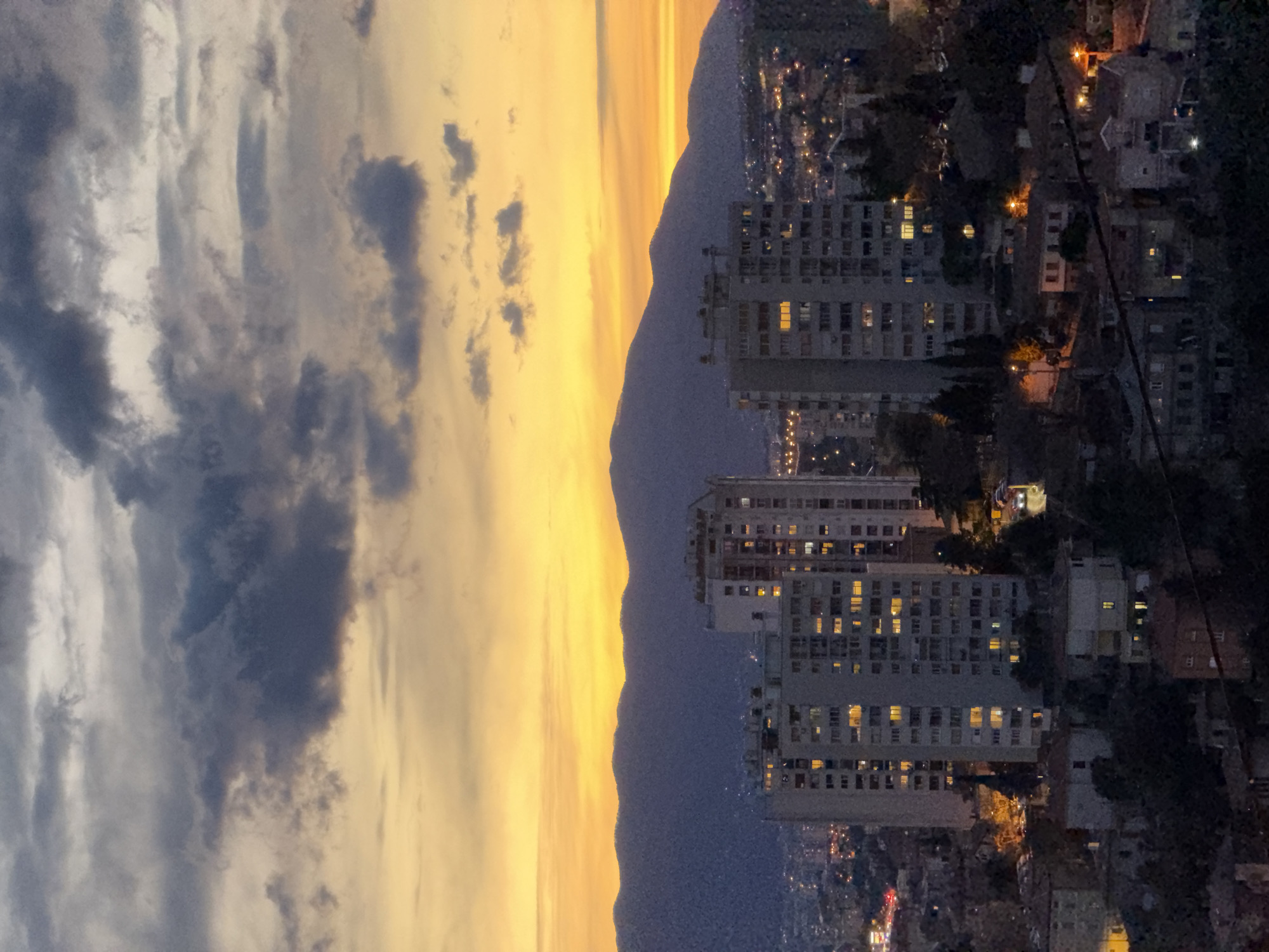 Nighttime view captures illuminated Rijeka cityscape from above
