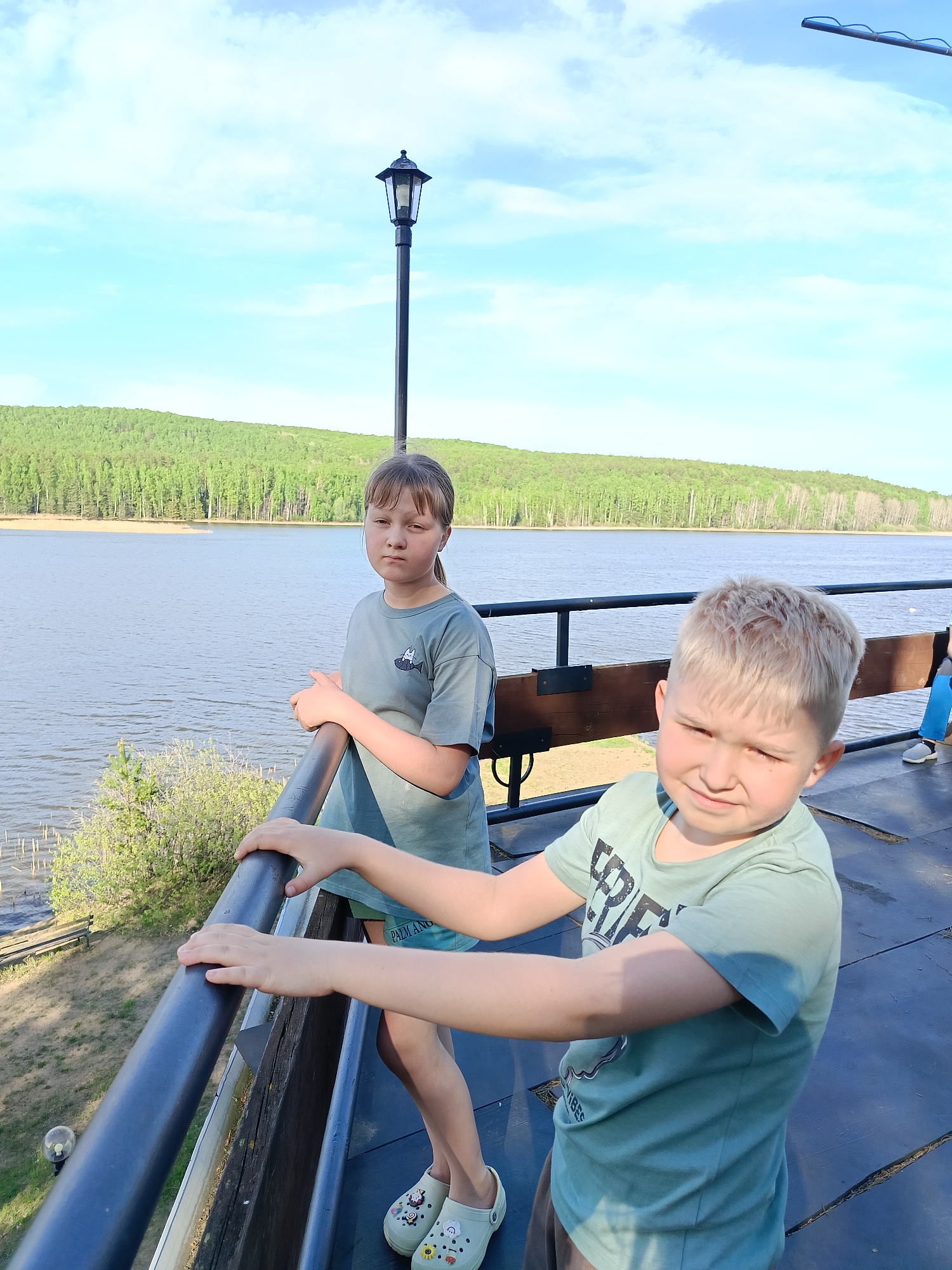 Children visit waterfront boardwalk at Kama Reservoir, Chaykovsky