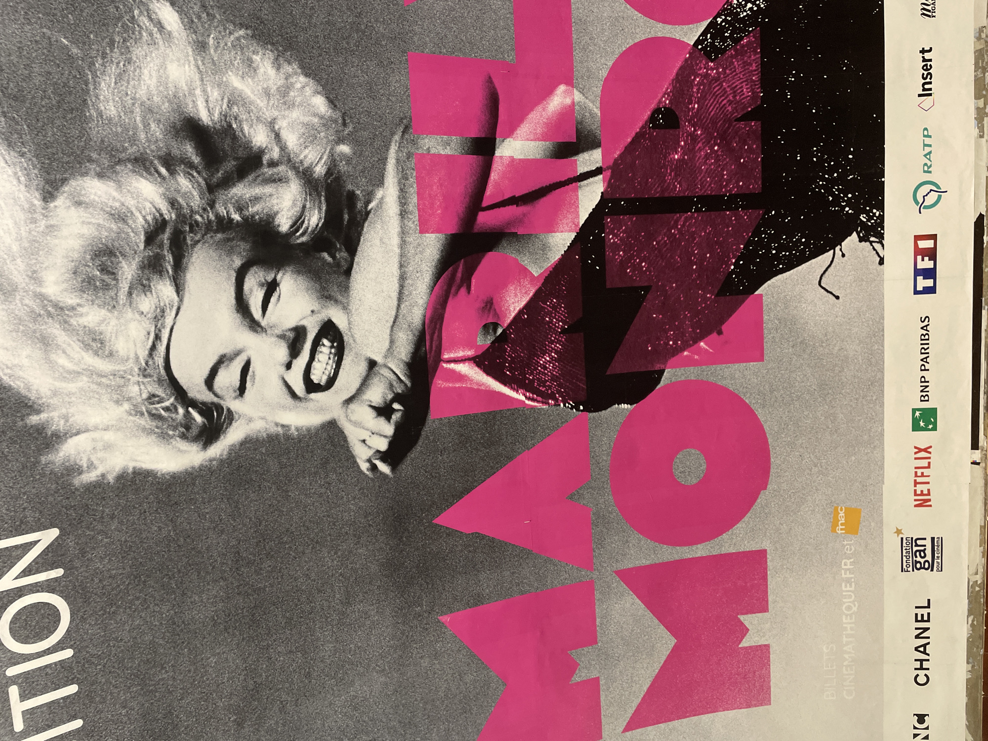 Urban scenes captured: Marilyn Monroe poster, subway train at station