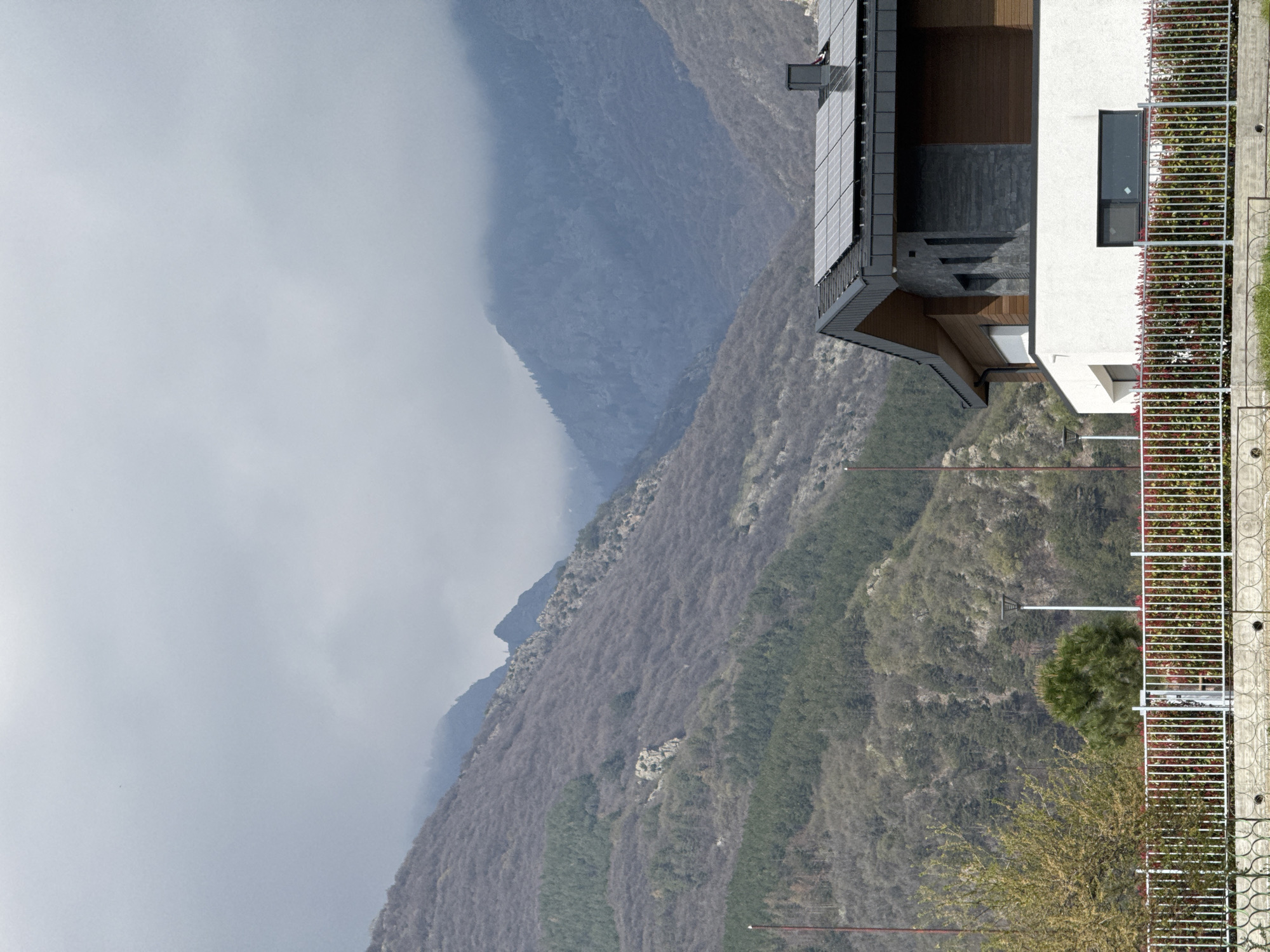 Person in athletic wear walks paths near Bulgarian mountain homes