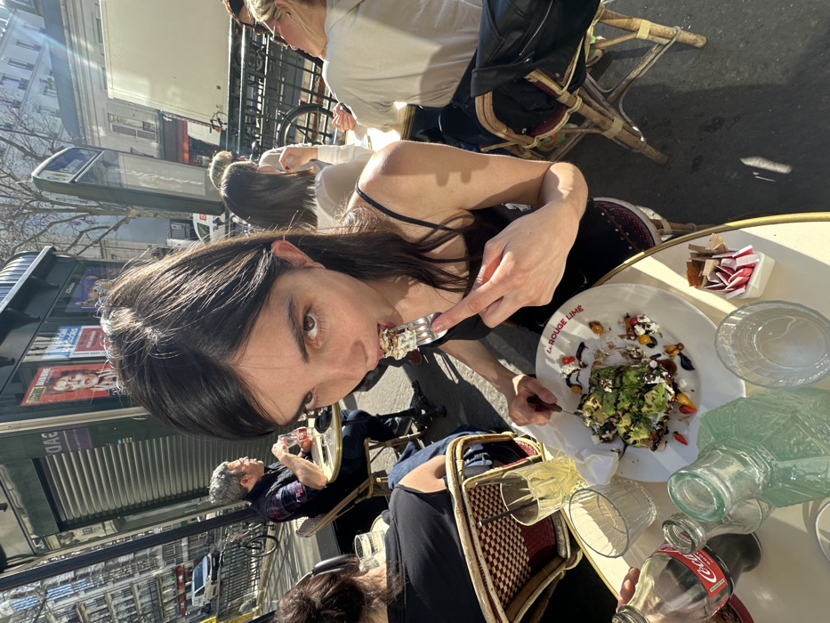 Couple enjoys afternoon at Parisian street cafe