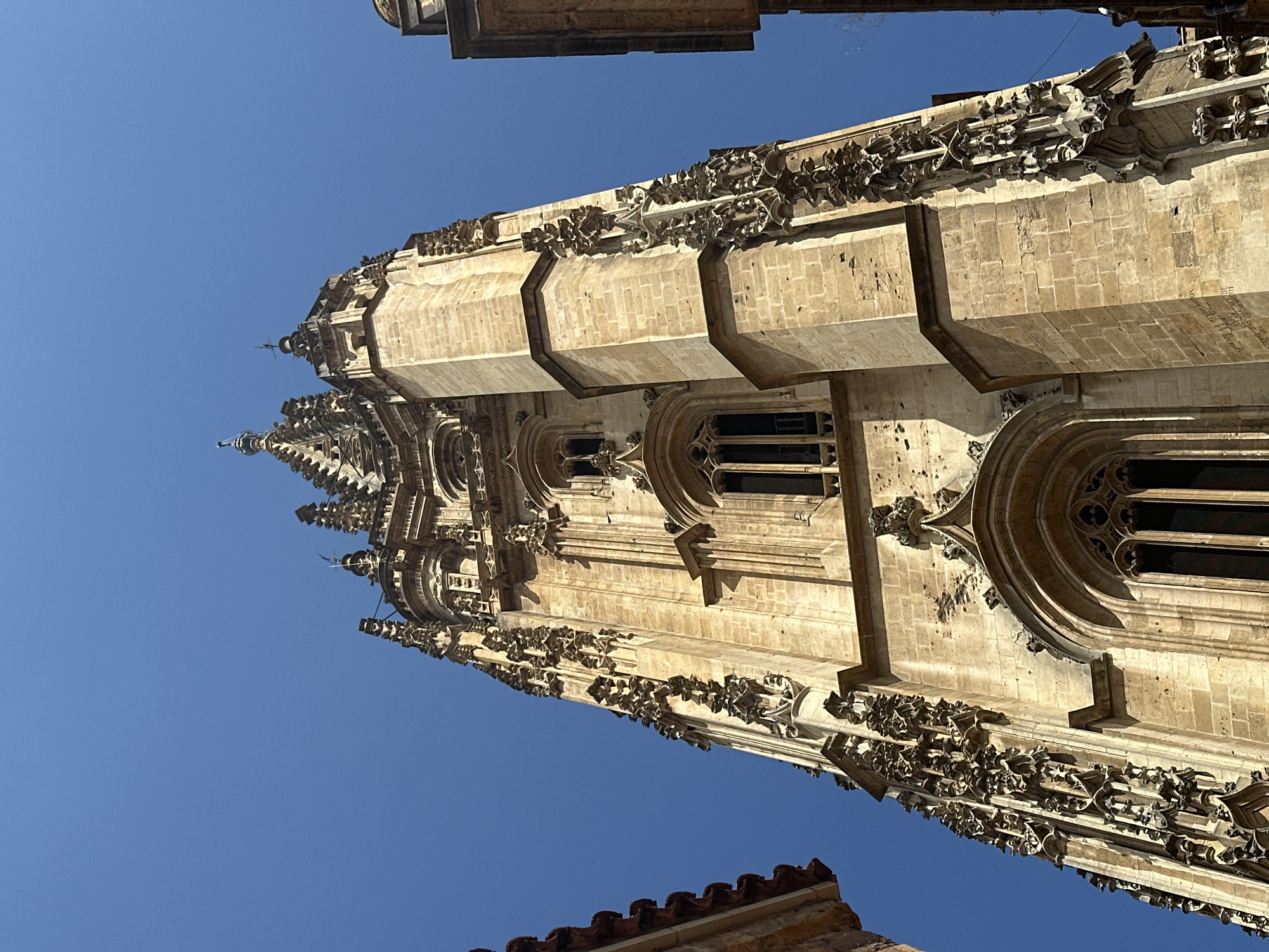 Up-close with Oviedo Cathedral's Gothic stonework on a sunny morning