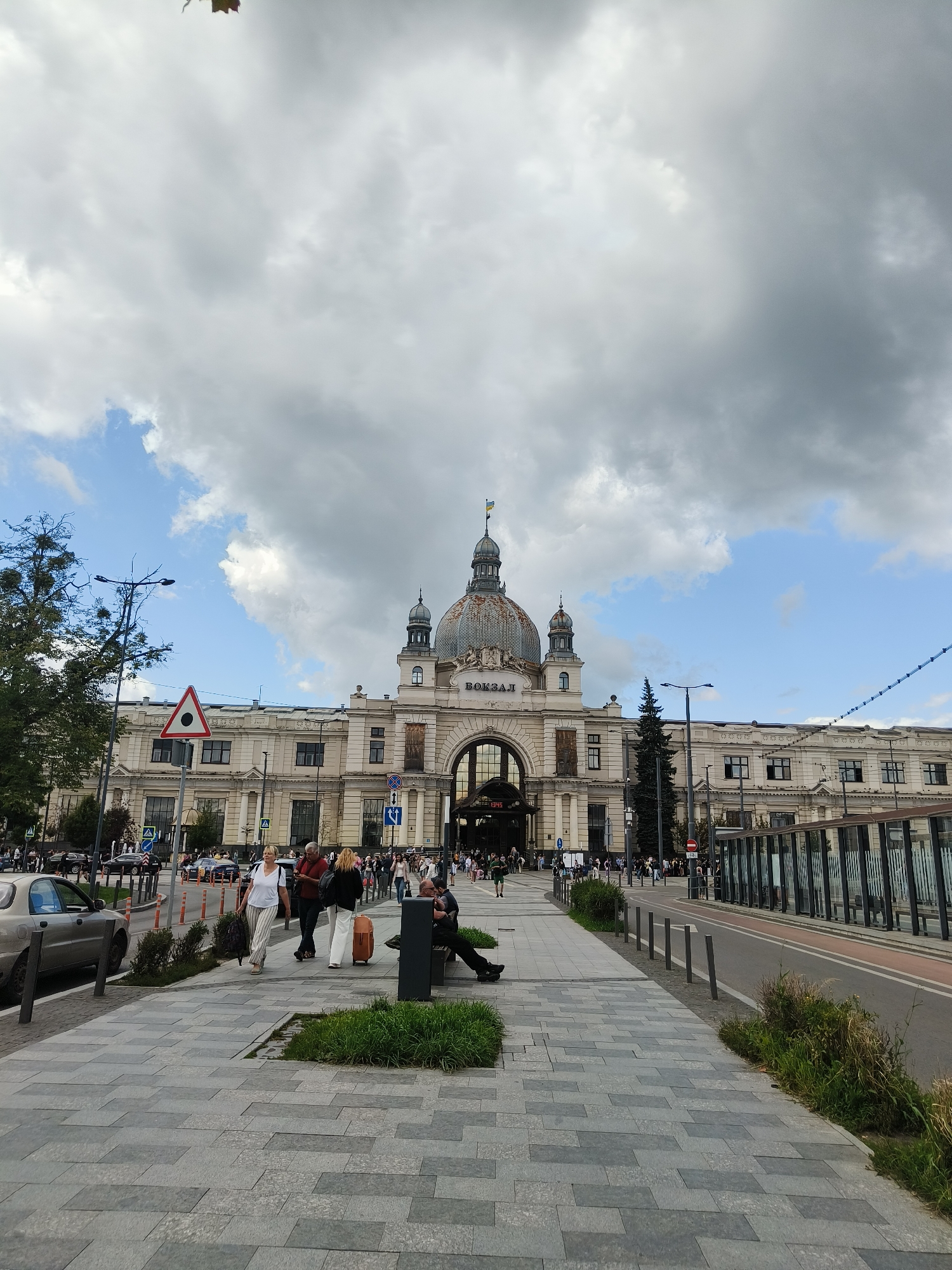 Lviv's iconic domed railway station under overcast skies
