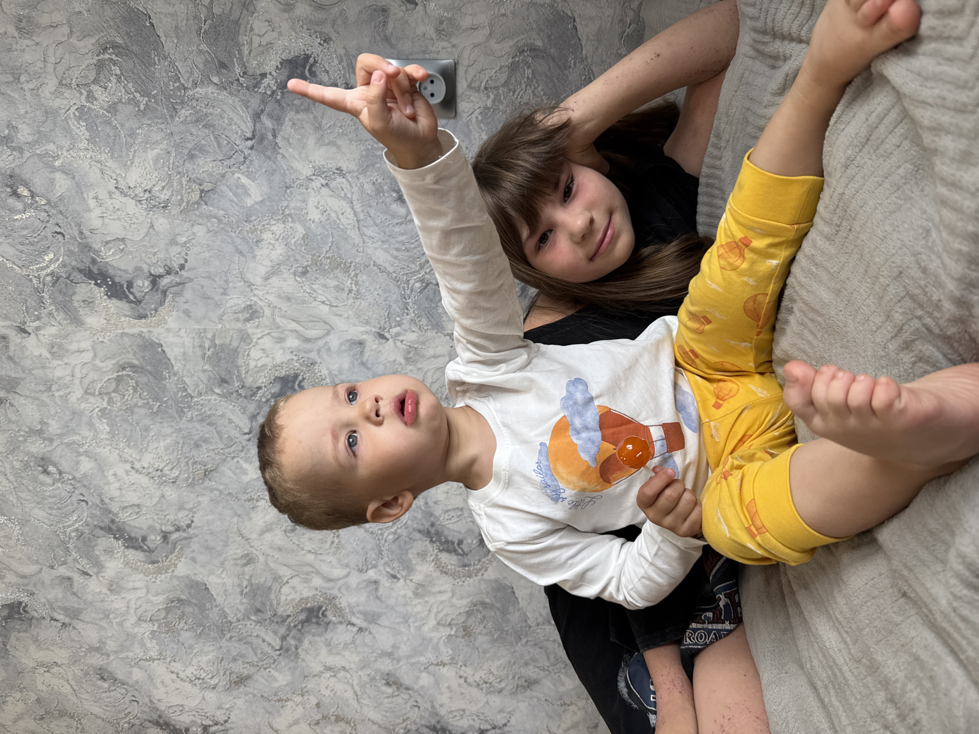Children playing indoors in Rusanovo home Friday morning