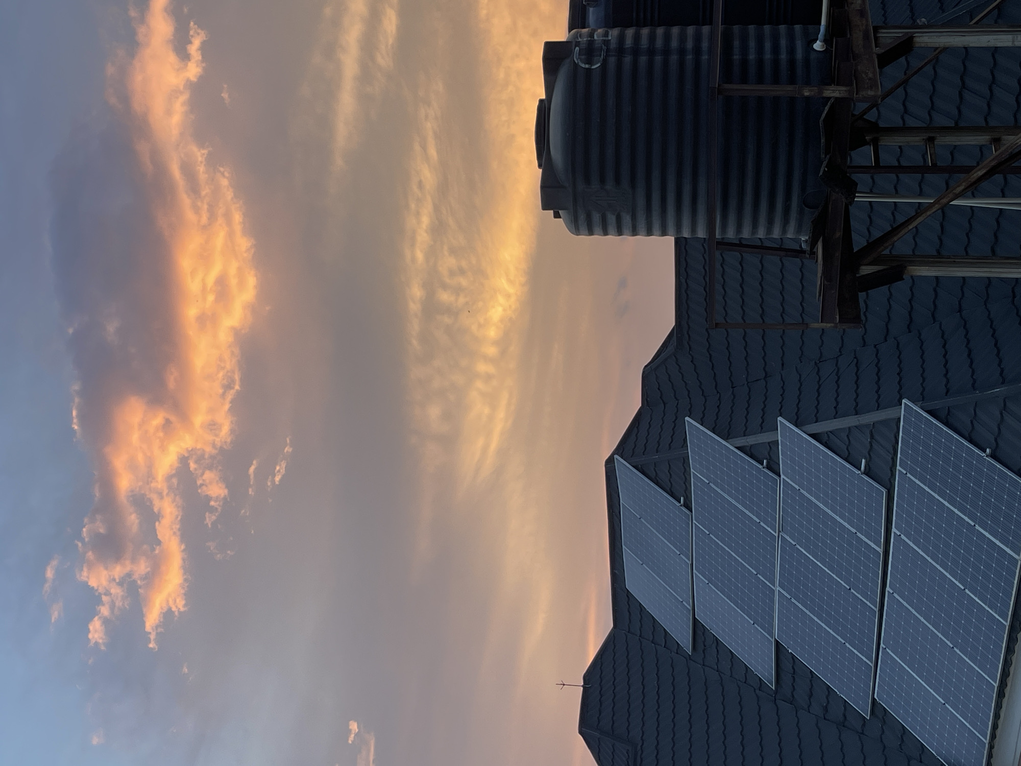 Golden hour over Abuja rooftops, July evening